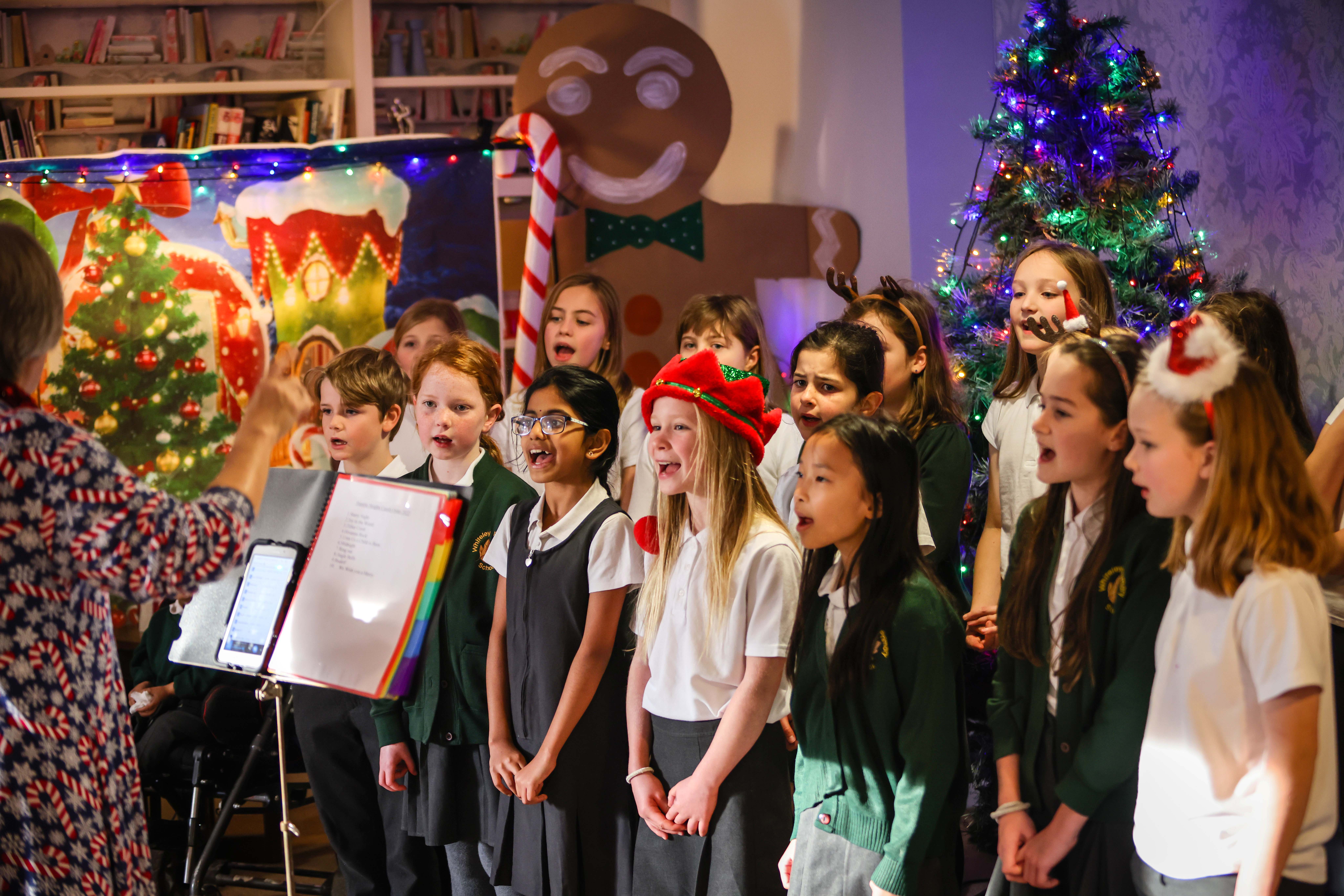 Handout pic of children from Whiteley Primary School singing carols at Hamble Heights care home, operated by Encore Care Homes. (Hamble Heights/PA)
