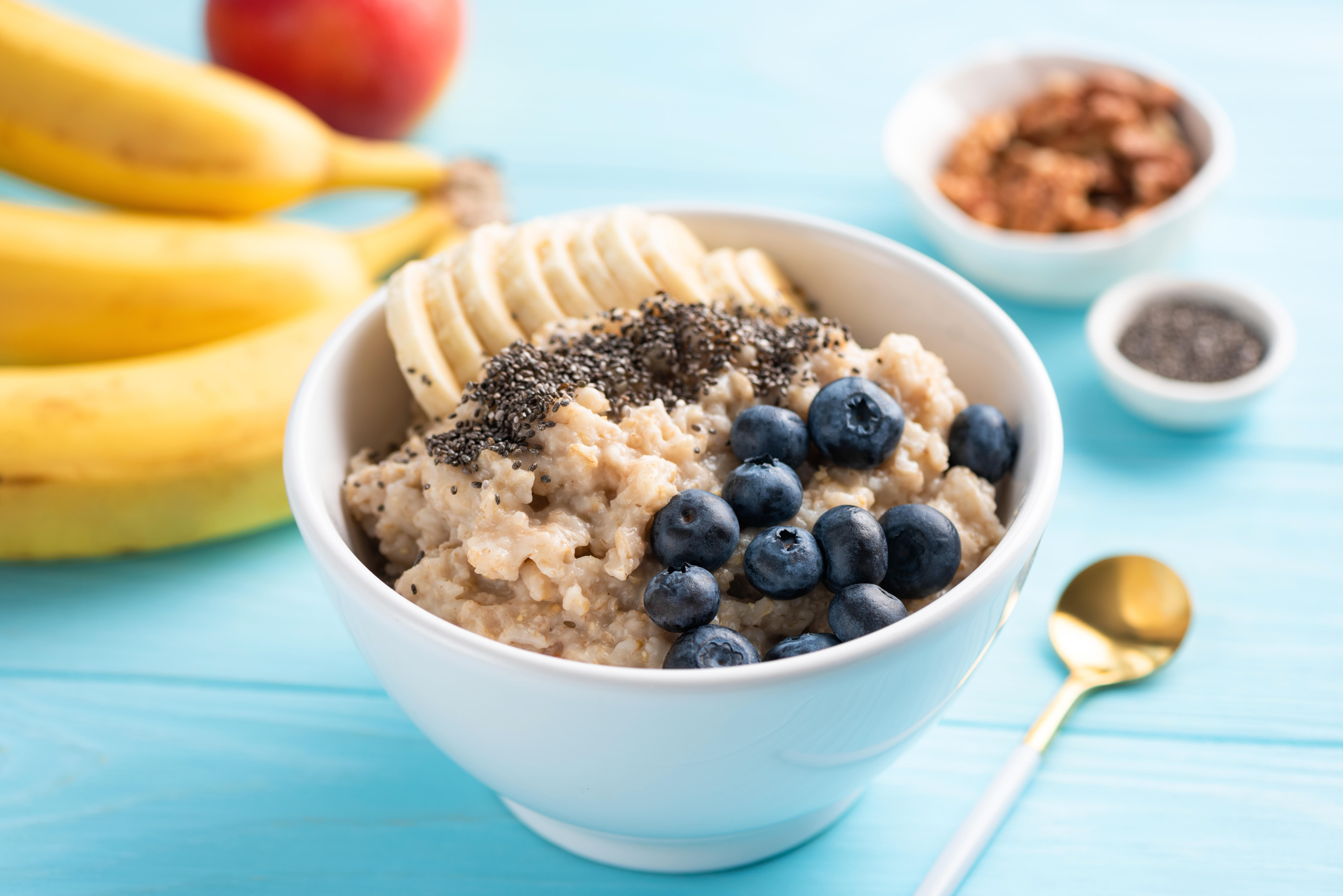 A bowl of porridge oats with banana and blueberries 