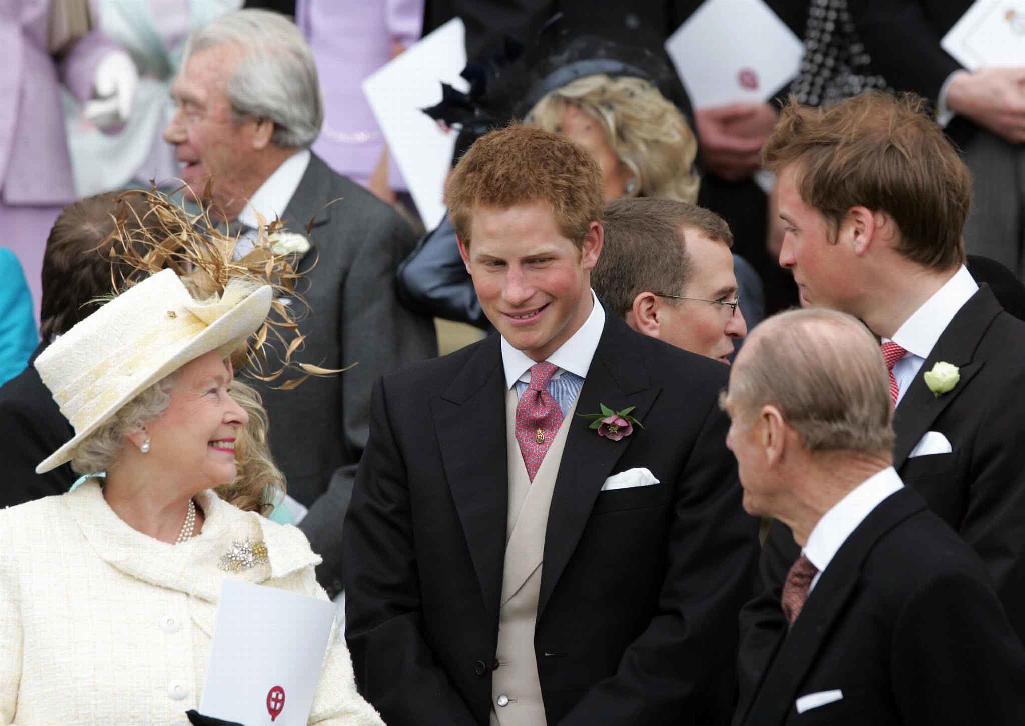 Harry (C) stands between Queen Elizabeth (L) the Duke of Edinburgh (R)