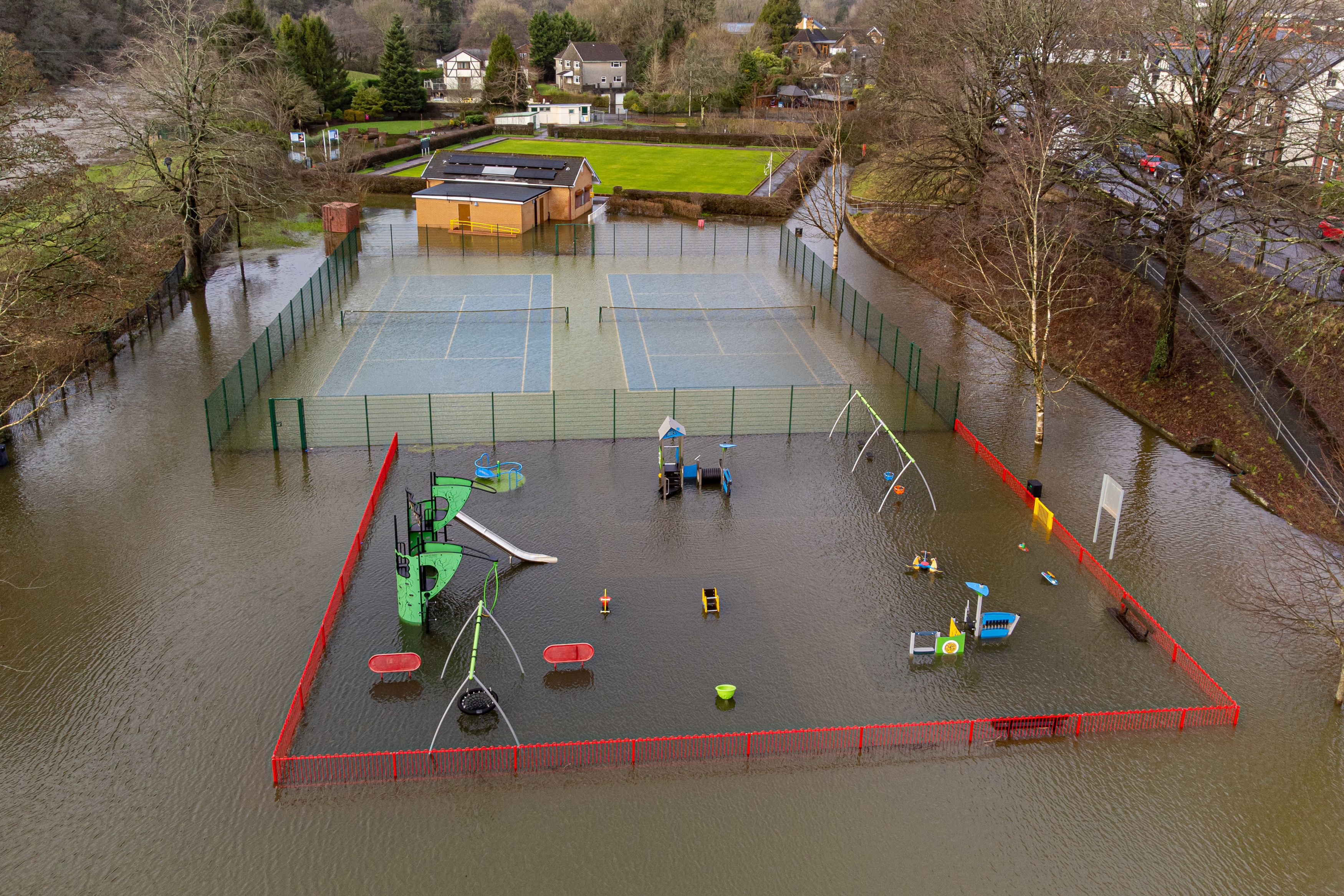 Flooding next to the River Taff has submerged the play park in Taff's Well, Wales