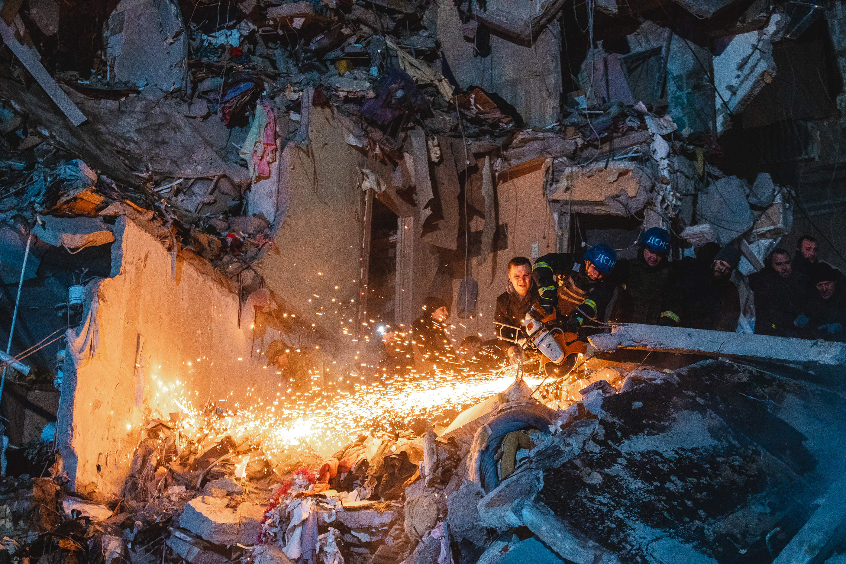 Arsen Dzodzaiev's photo of emergency services cutting through building debris