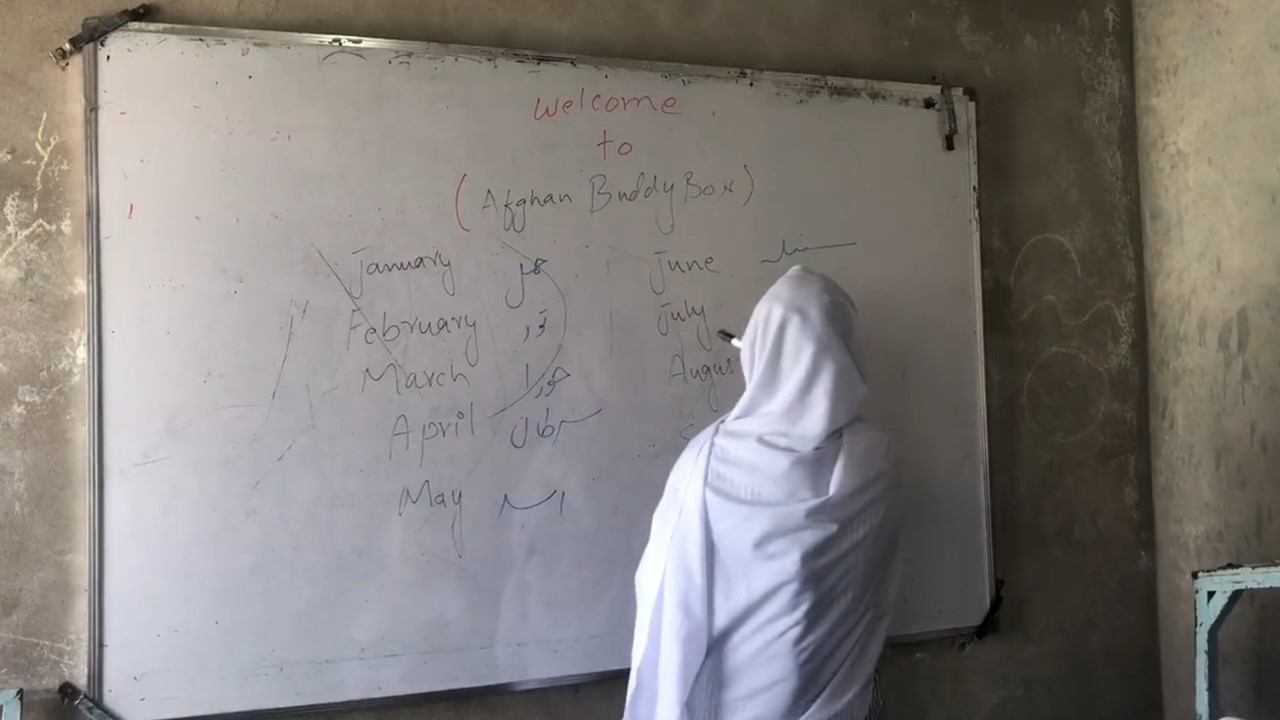 Woman writing on a board