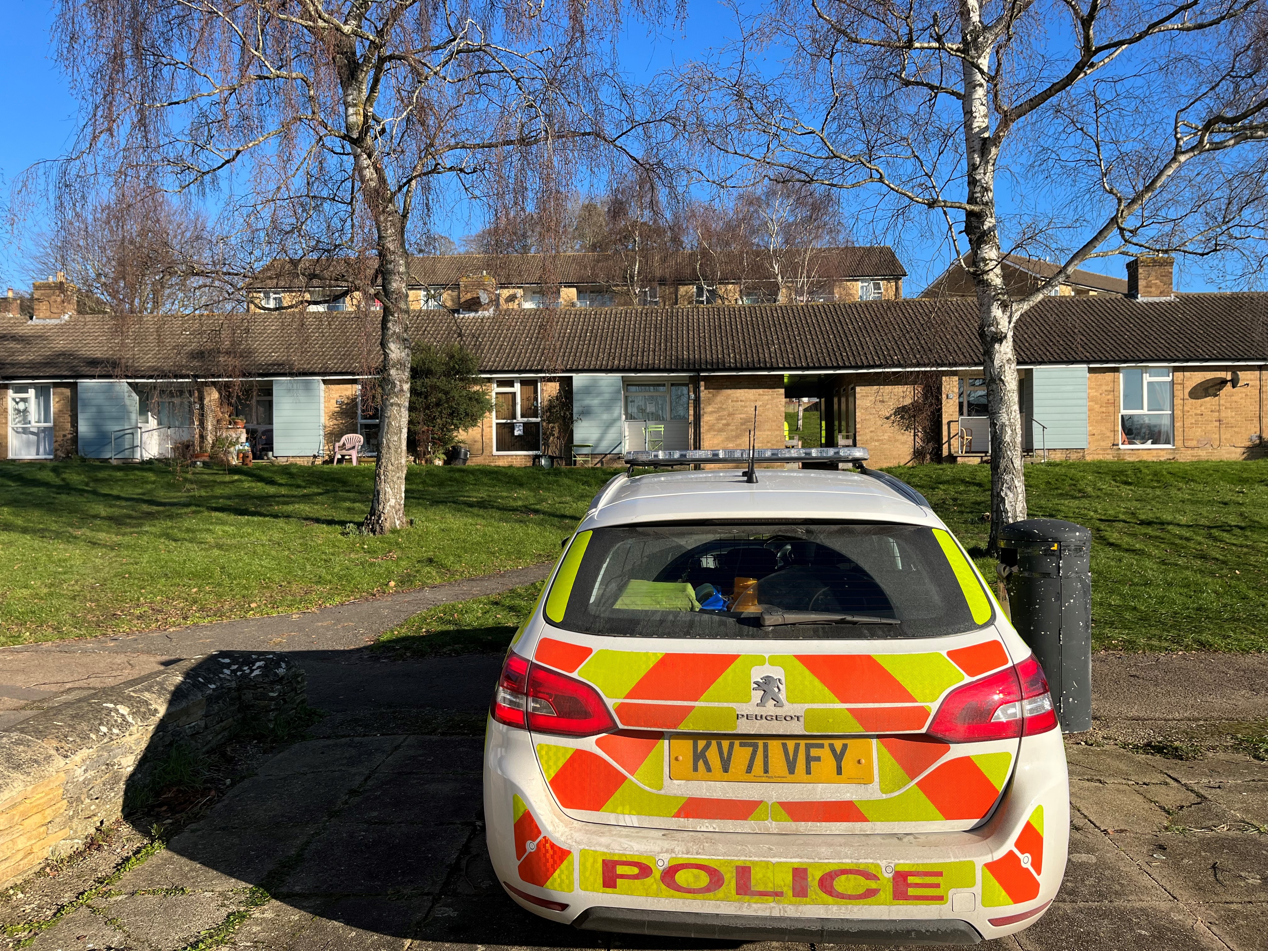 A police car was parked outside a bungalow on Archway Gardens in Paganhill, Stroud (Rod Minchin/PA)