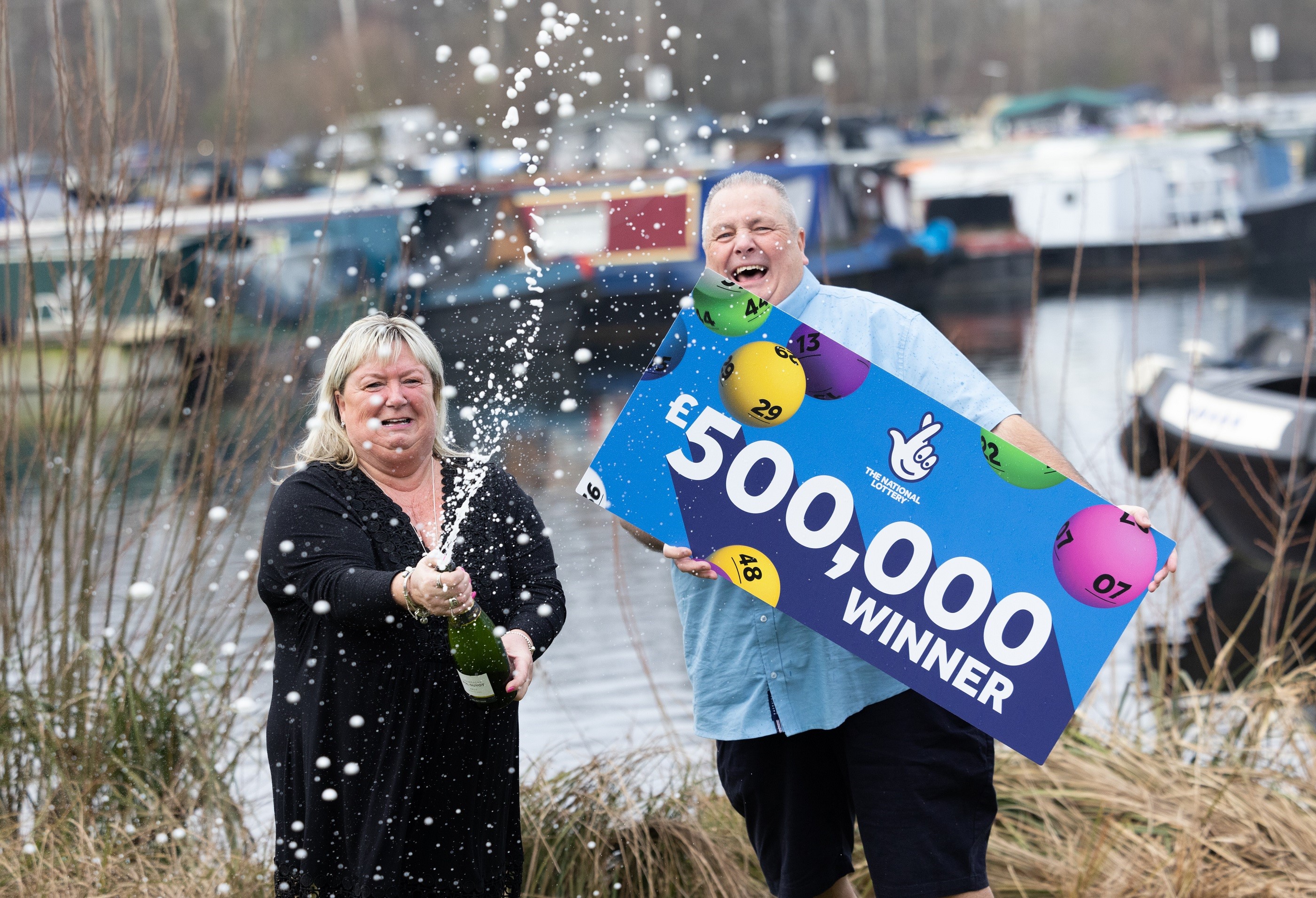 Jeff Etherington, 65, of Harlow, Essex, celebrates with his finacee Kim Read after winning £500,000 on the lottery. (National Lottery/ PA)