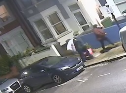 A CCTV still of the couple in a residential street.