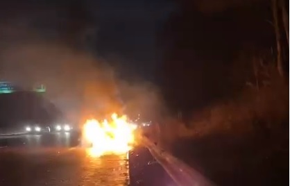 A still image of the police body carried video of the abandoned car on fire.