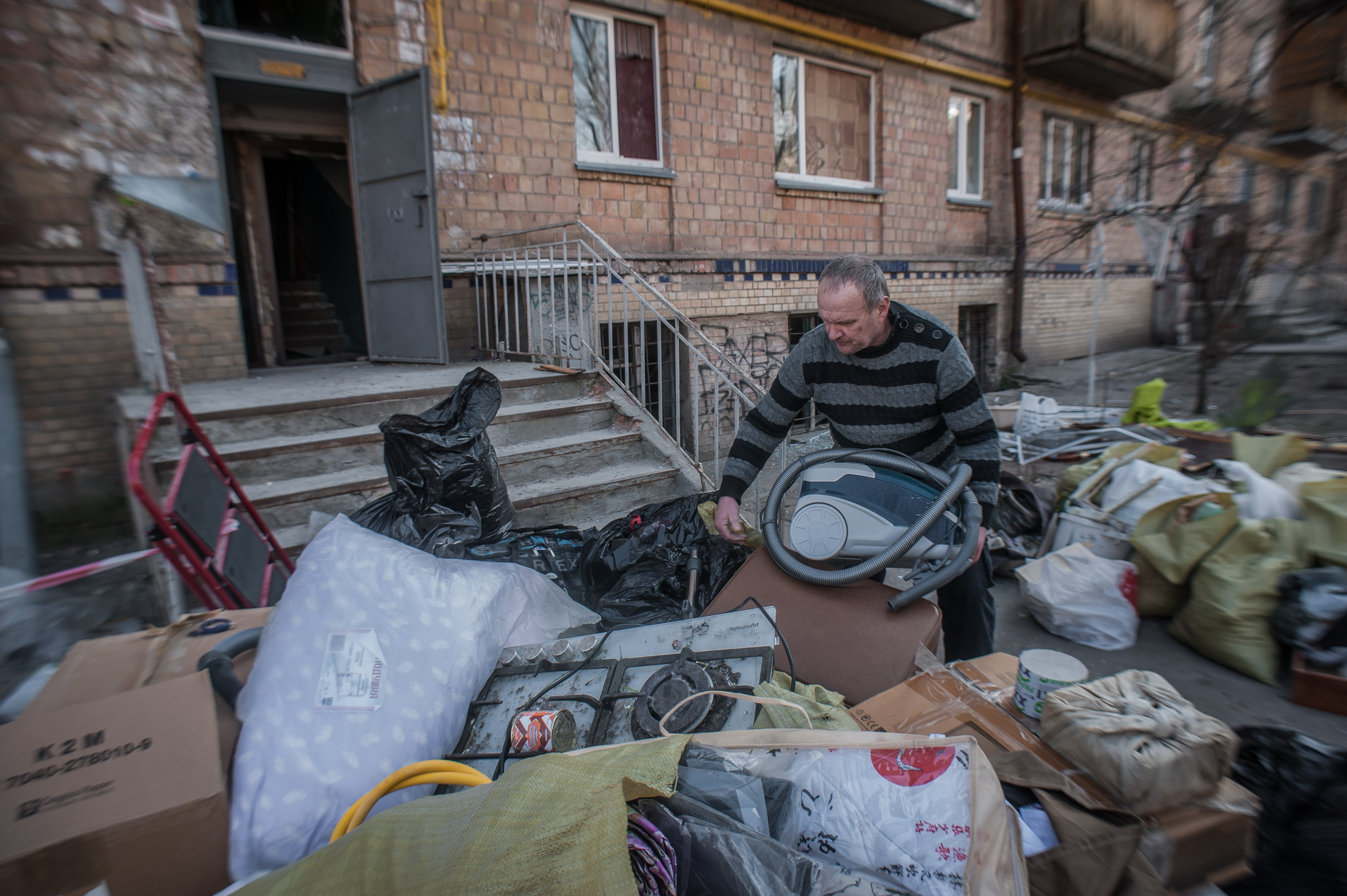 Man rummaging through boxes