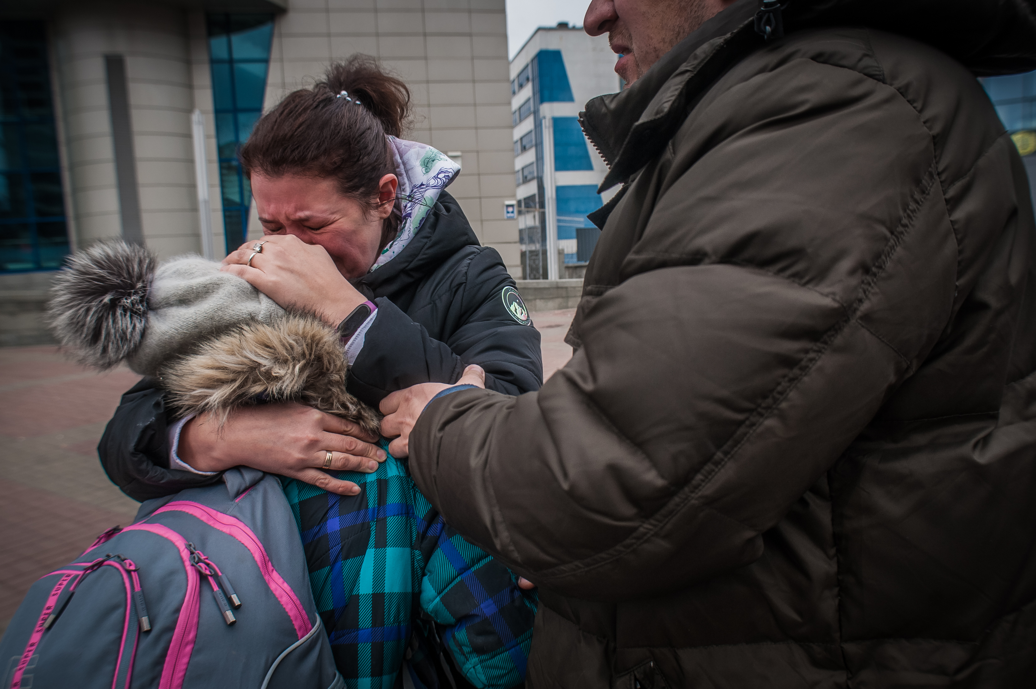 Woman hugging a girl and crying