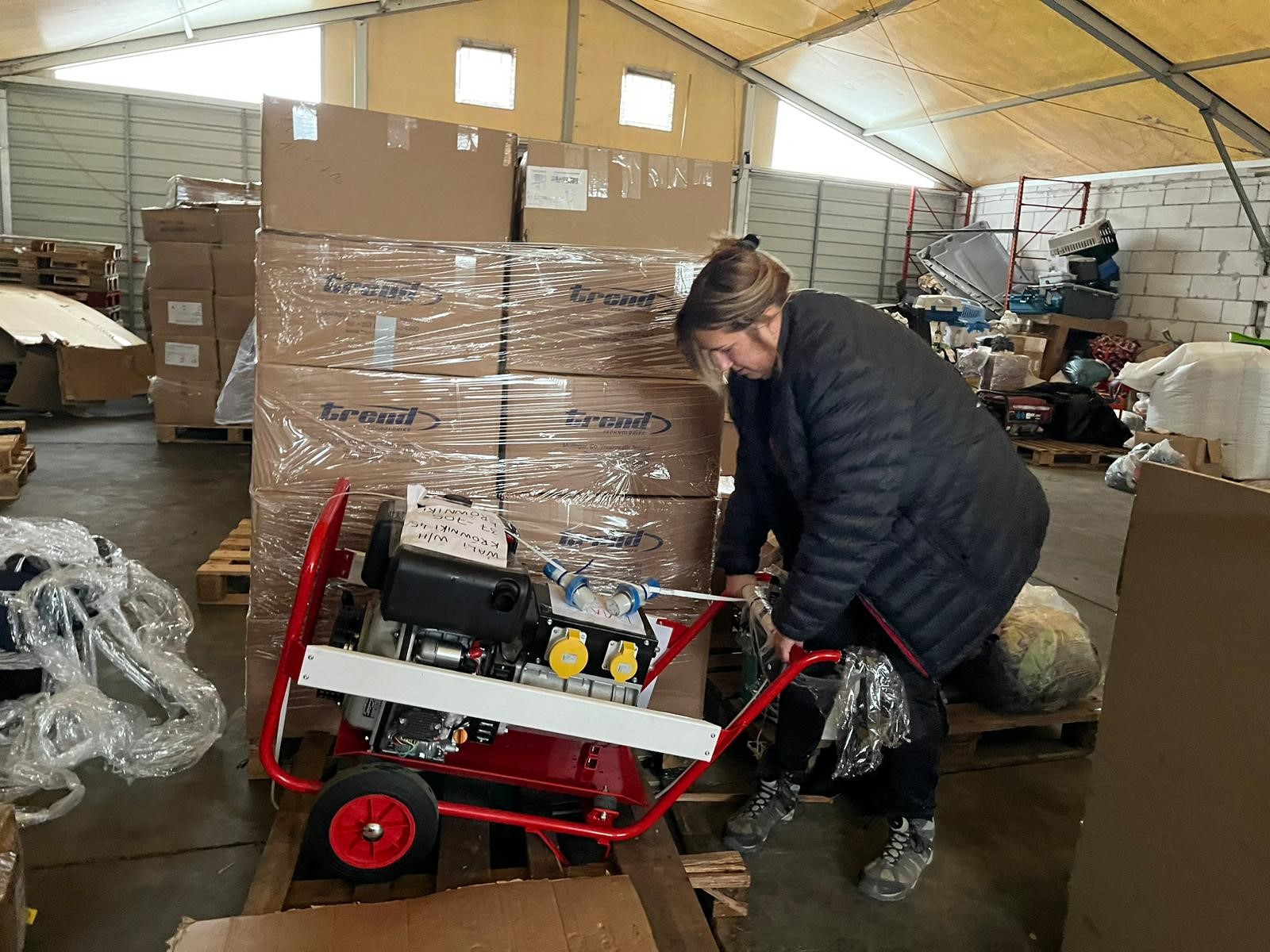 Woman lugging around boxes 