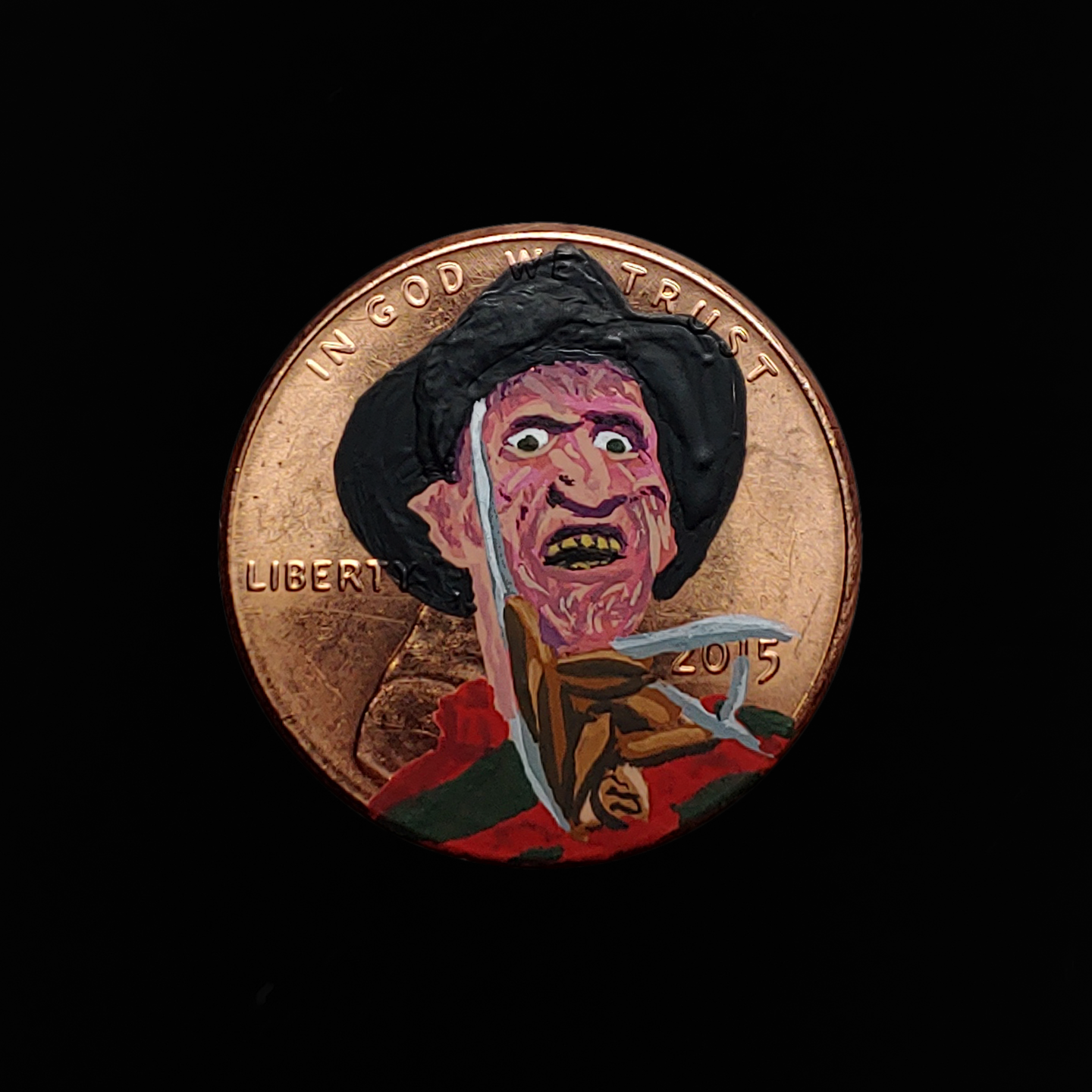 Man with a blade as a hand on a penny