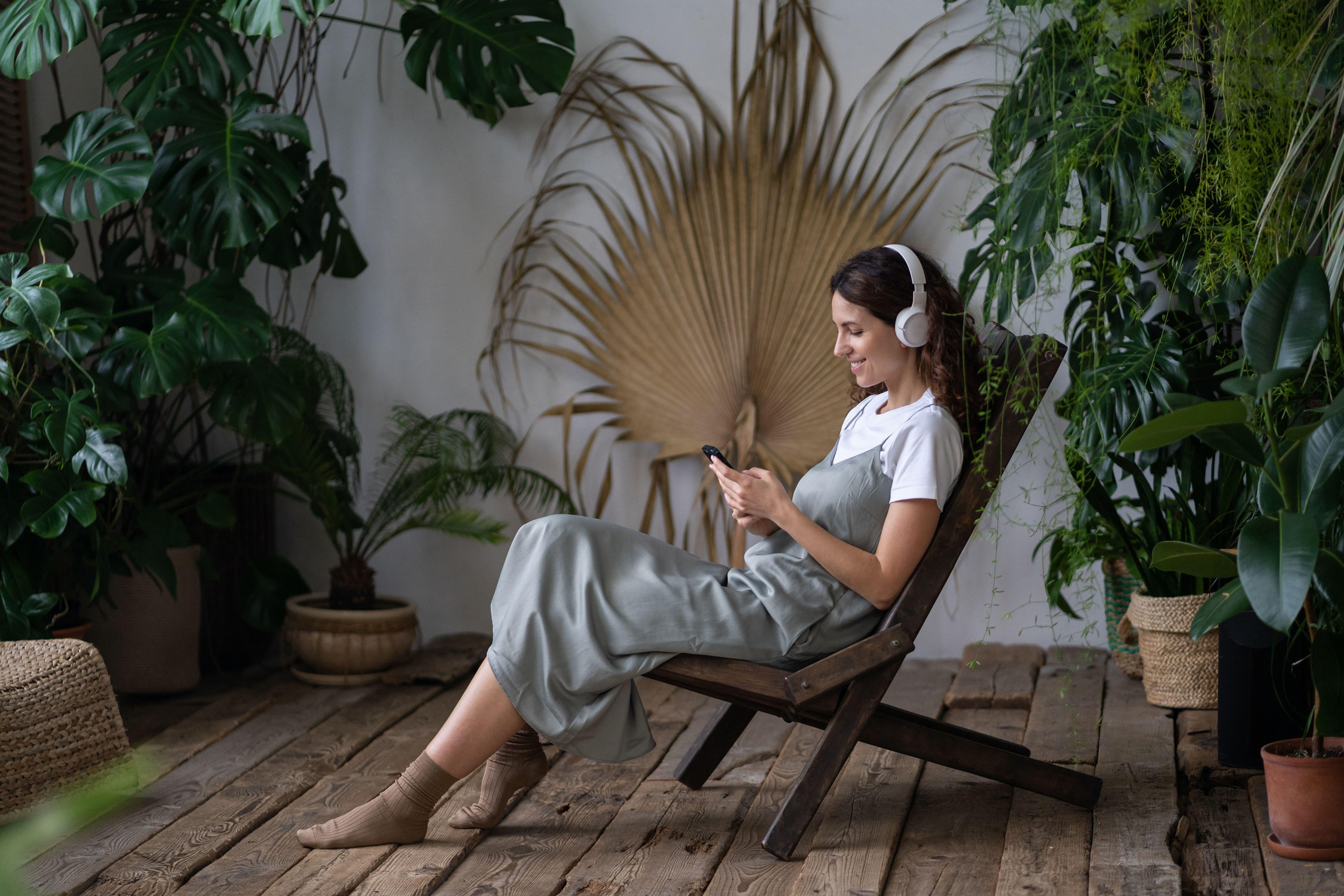 Woman relaxing and listening to podcast