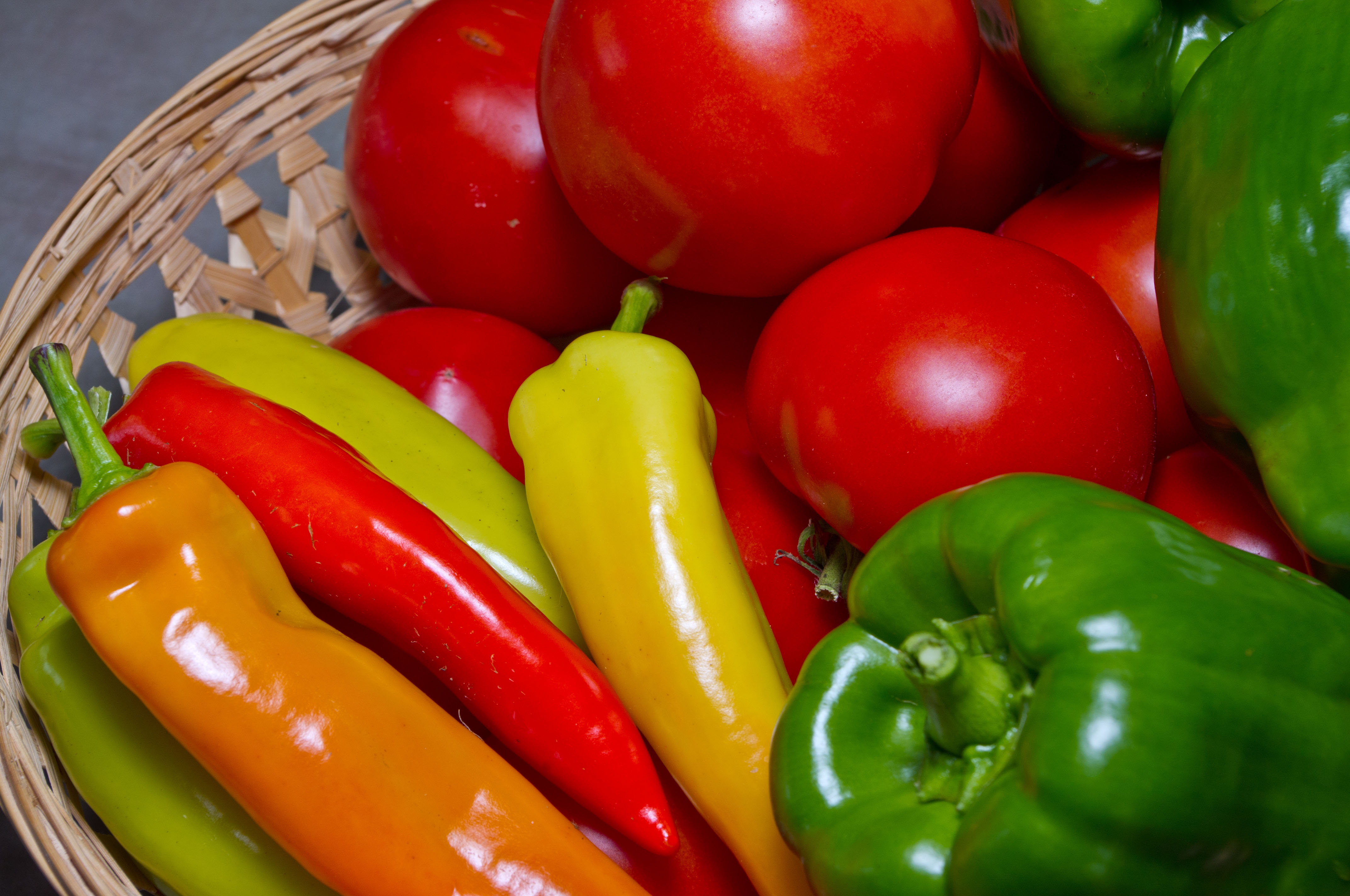 Basket with tomatoes and peppers