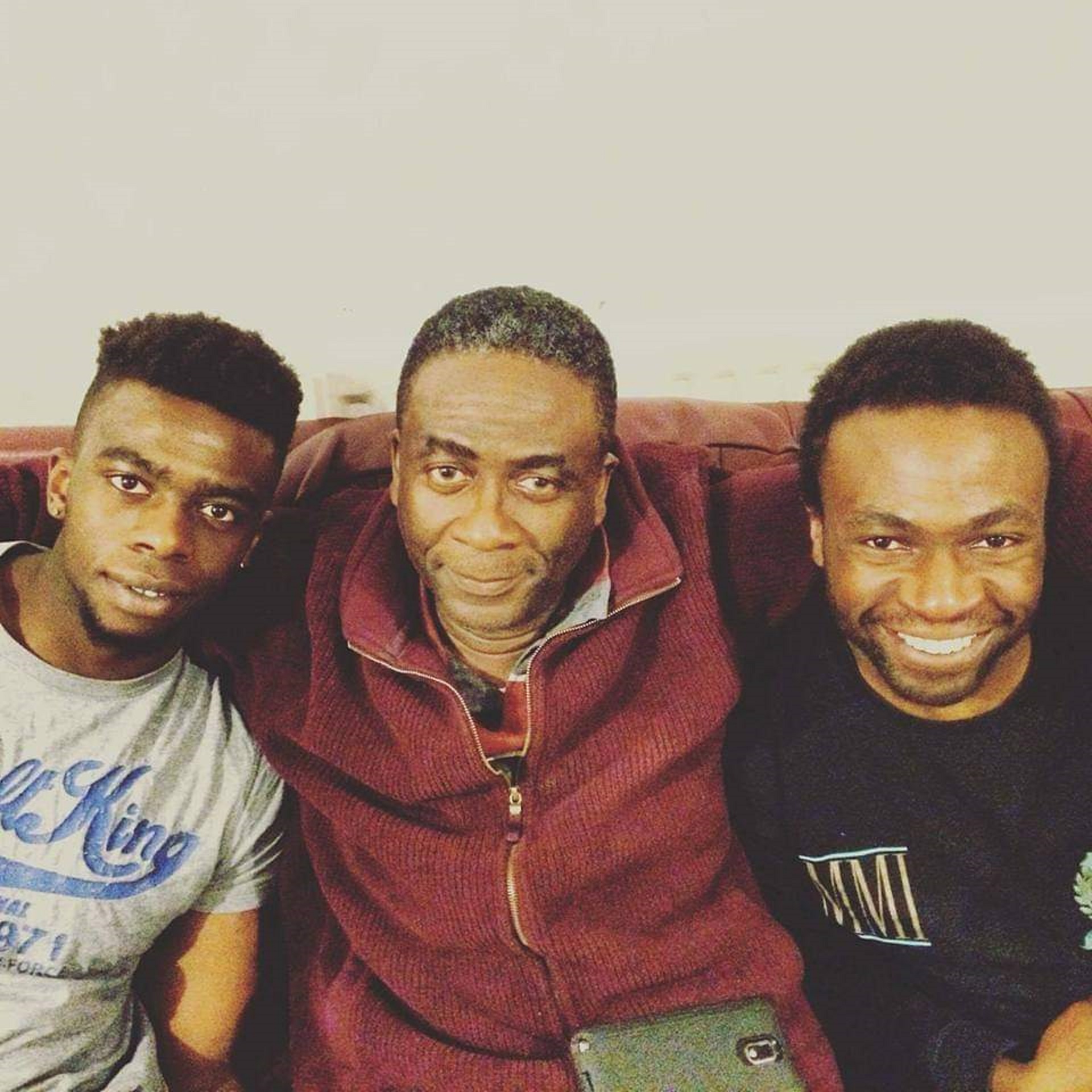 Lobby Akinnola (right) with his father Femi (centre) and brother Tugbi (left)