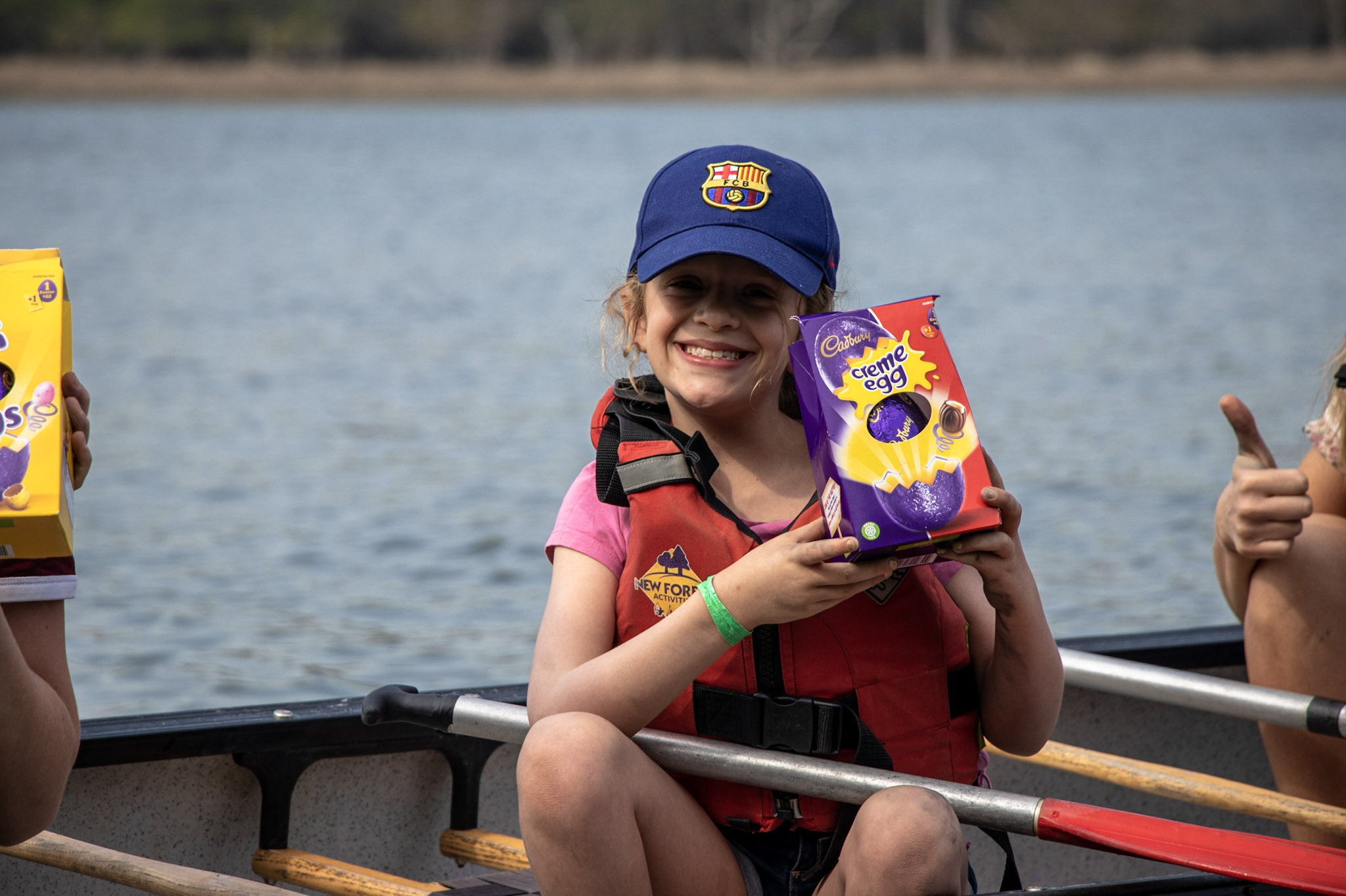 child on a boat with an Easter egg