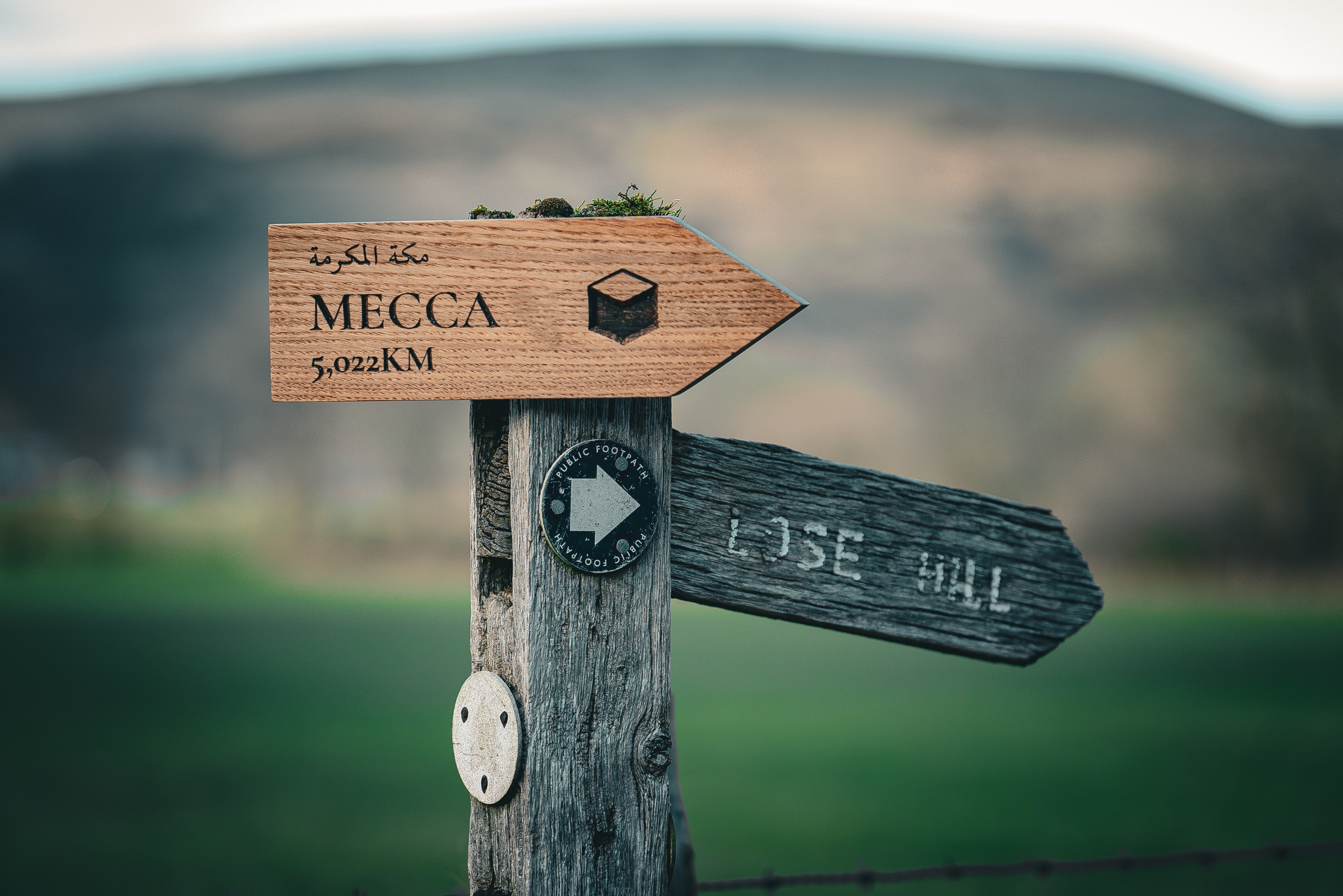 Wooden sign with an arrow at the end 