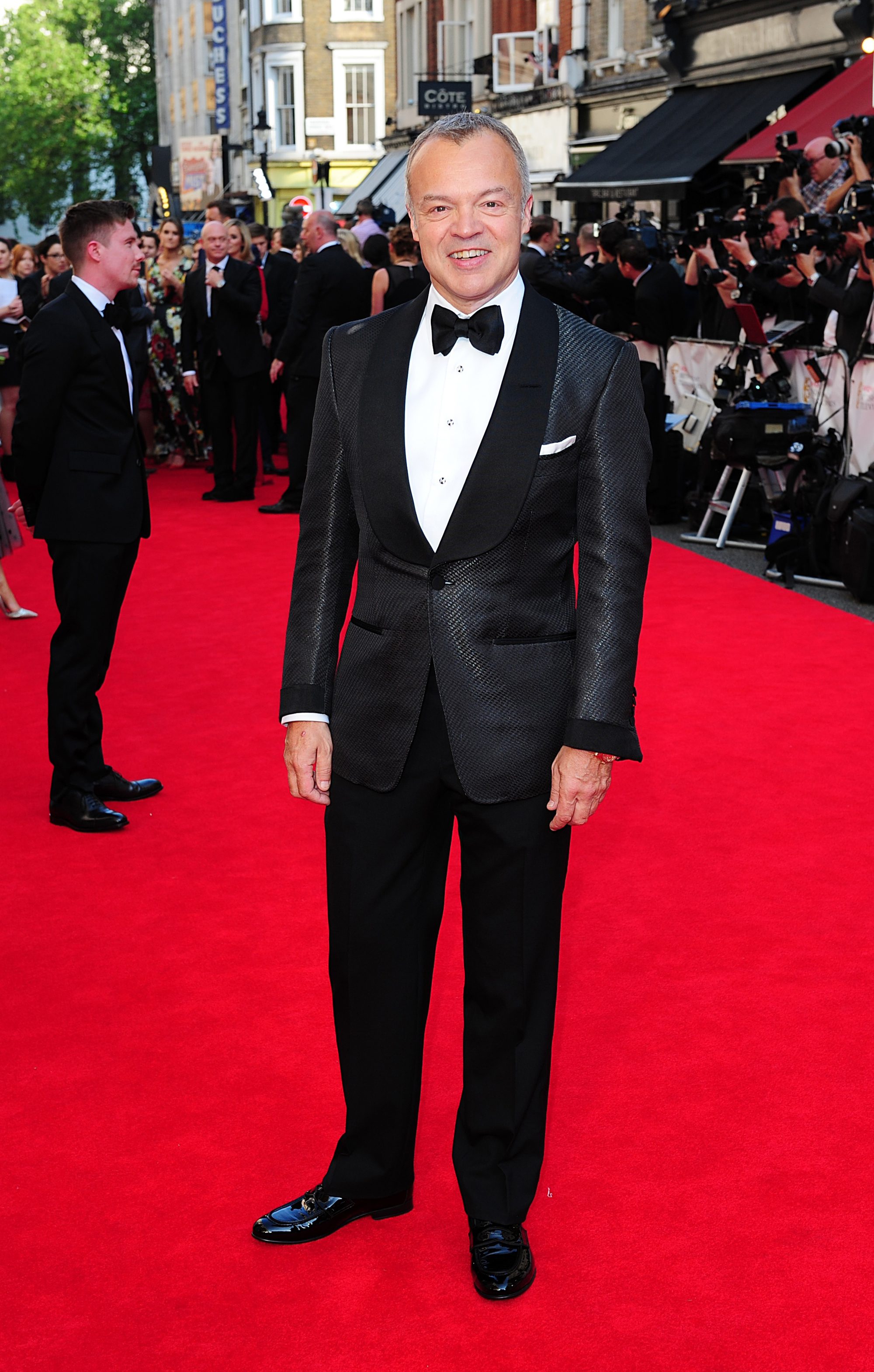 Graham Norton arriving for the 2014 Arqiva British Academy Television Awards