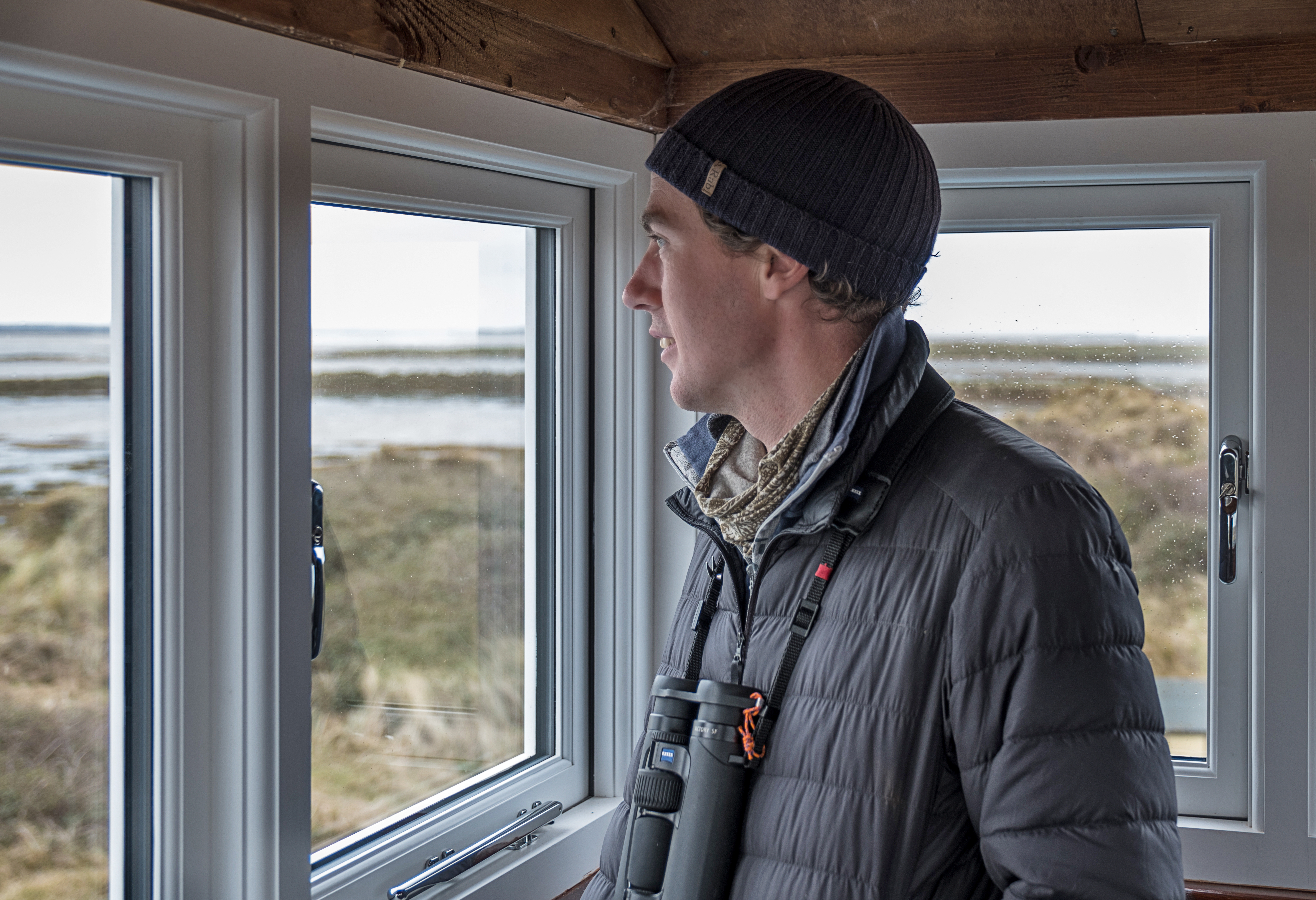 National Trust ranger Duncan Halpin keeping watch from the old lifeboat house on Blakeney Point (National Trust/ Hanne Siebers/ PA)