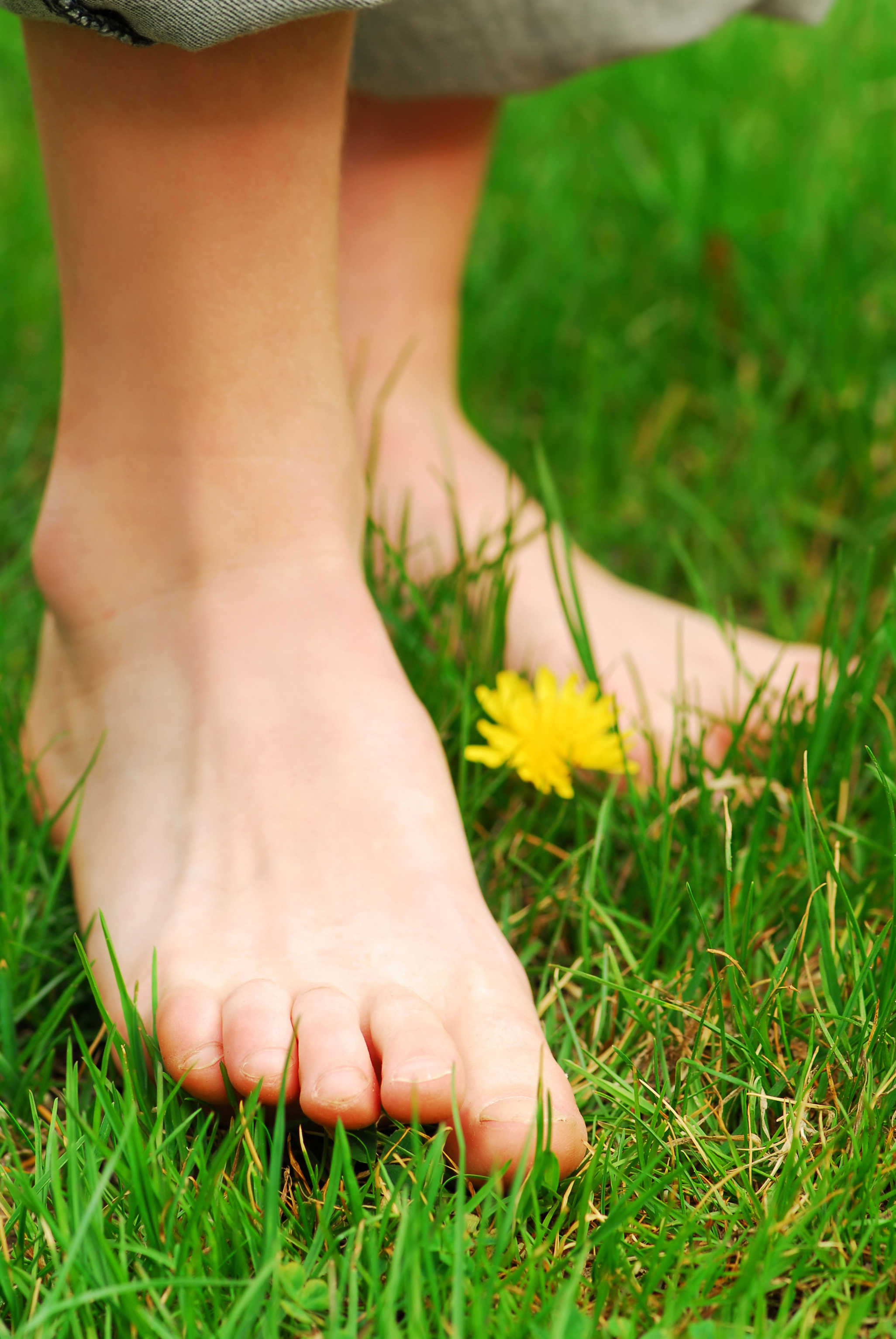 Walking barefoot on grass (Alamy/PA)