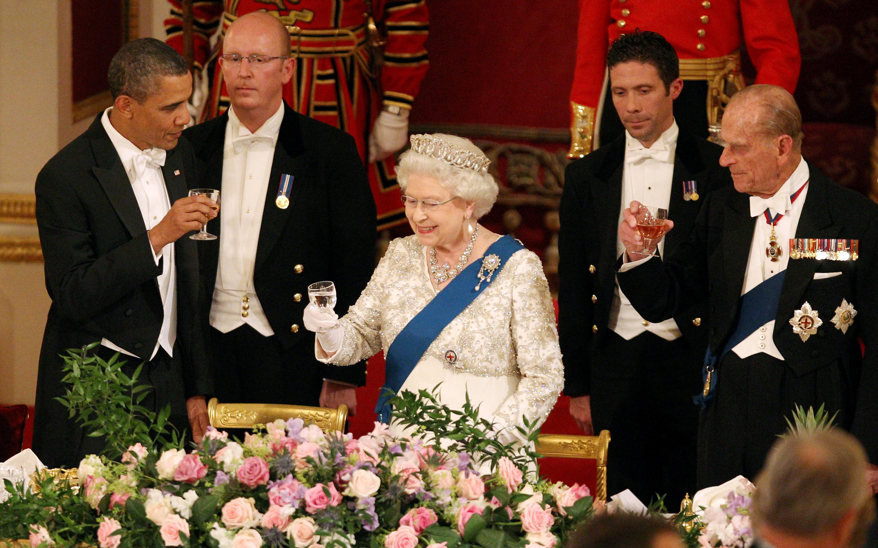 Queen Elizabeth II, US President Barack Obama and the Duke of Edinburgh during a State Banquet in Buckingham Palace in 2011