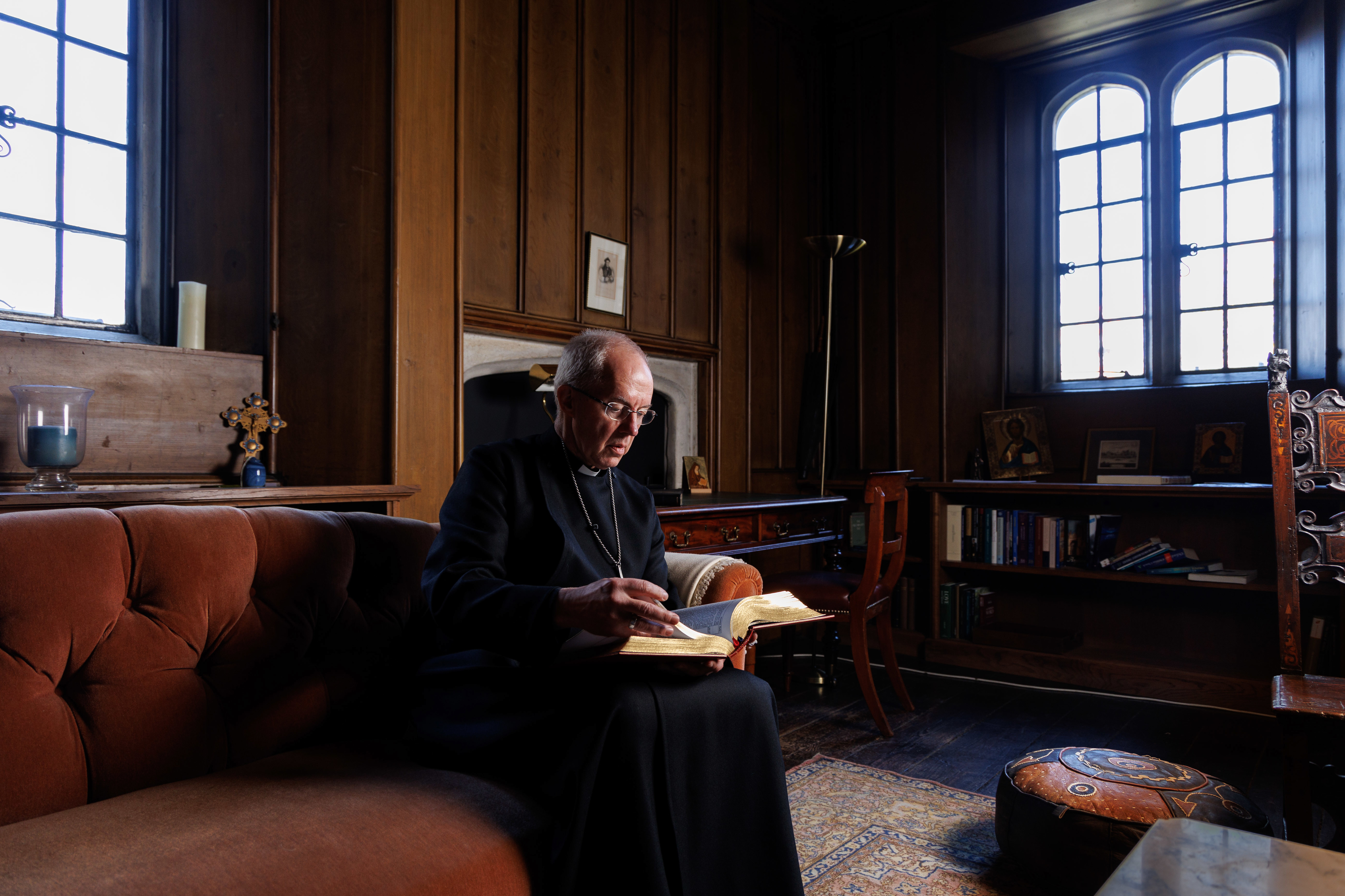 The Archbishop of Canterbury, the Most Revd Justin Welby, reading the King's Coronation Bible in the Cranmer Study at Lambeth Palace