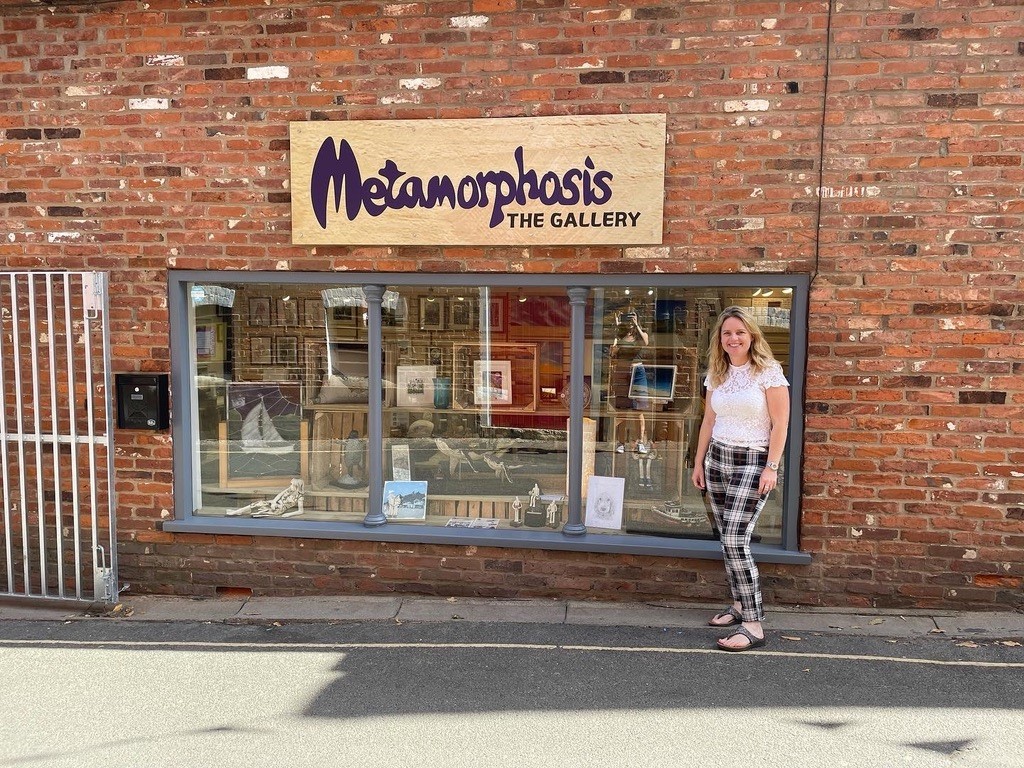 Woman posing outside of a gallery