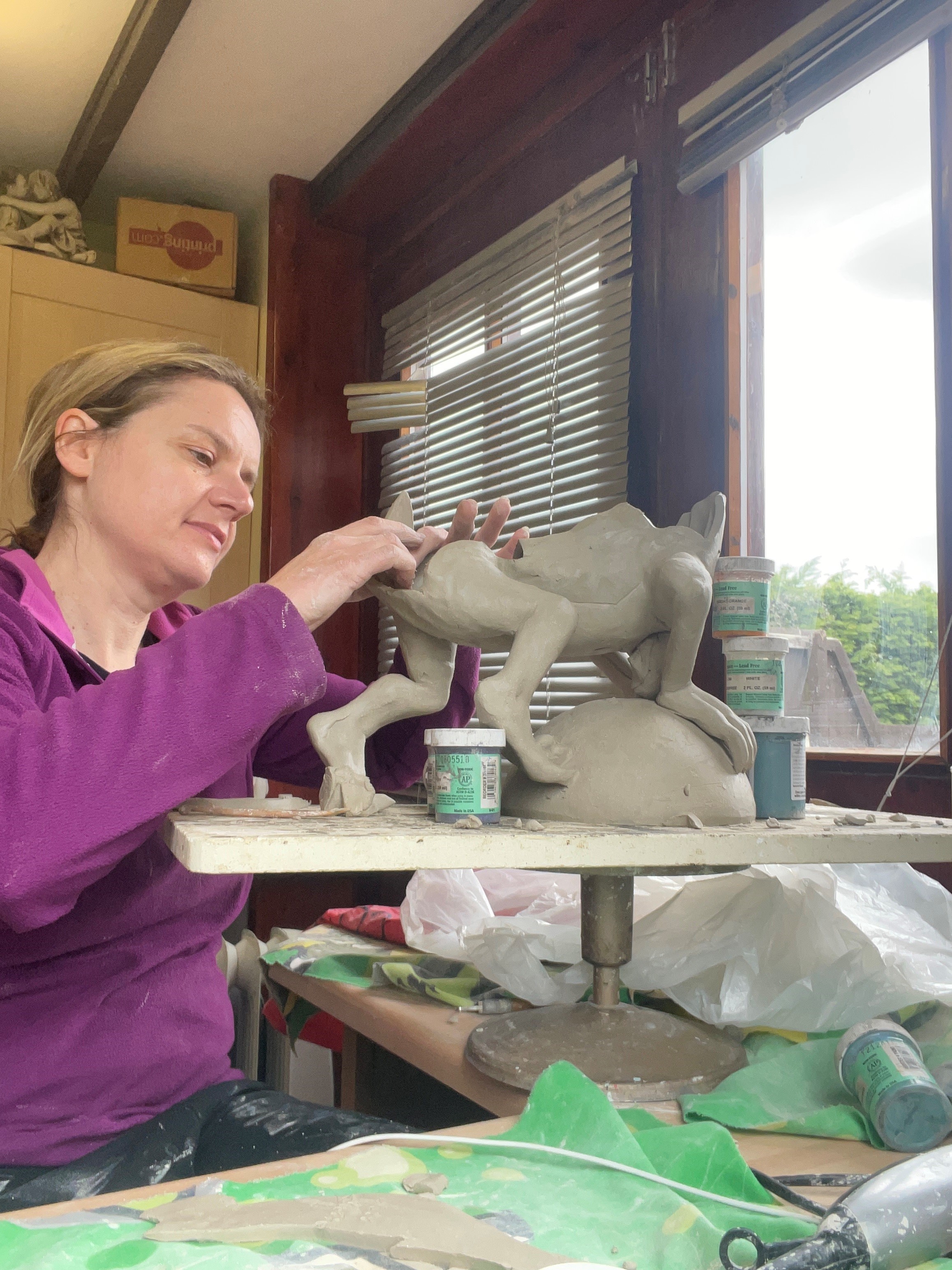 Woman working on a sculpture