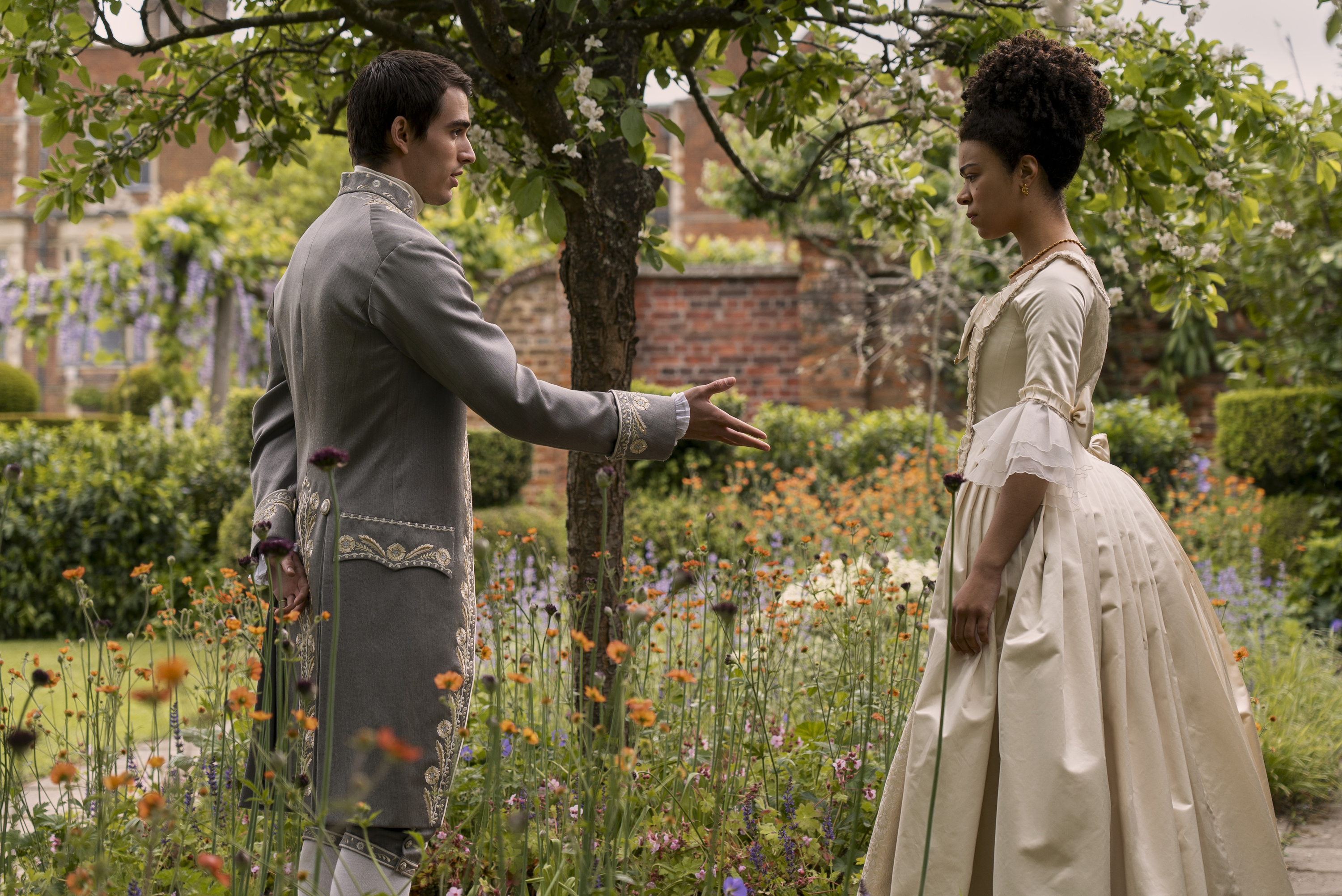 Corey Mylchreest as Young King George and India Amarteifio as Young Queen Charlotte 