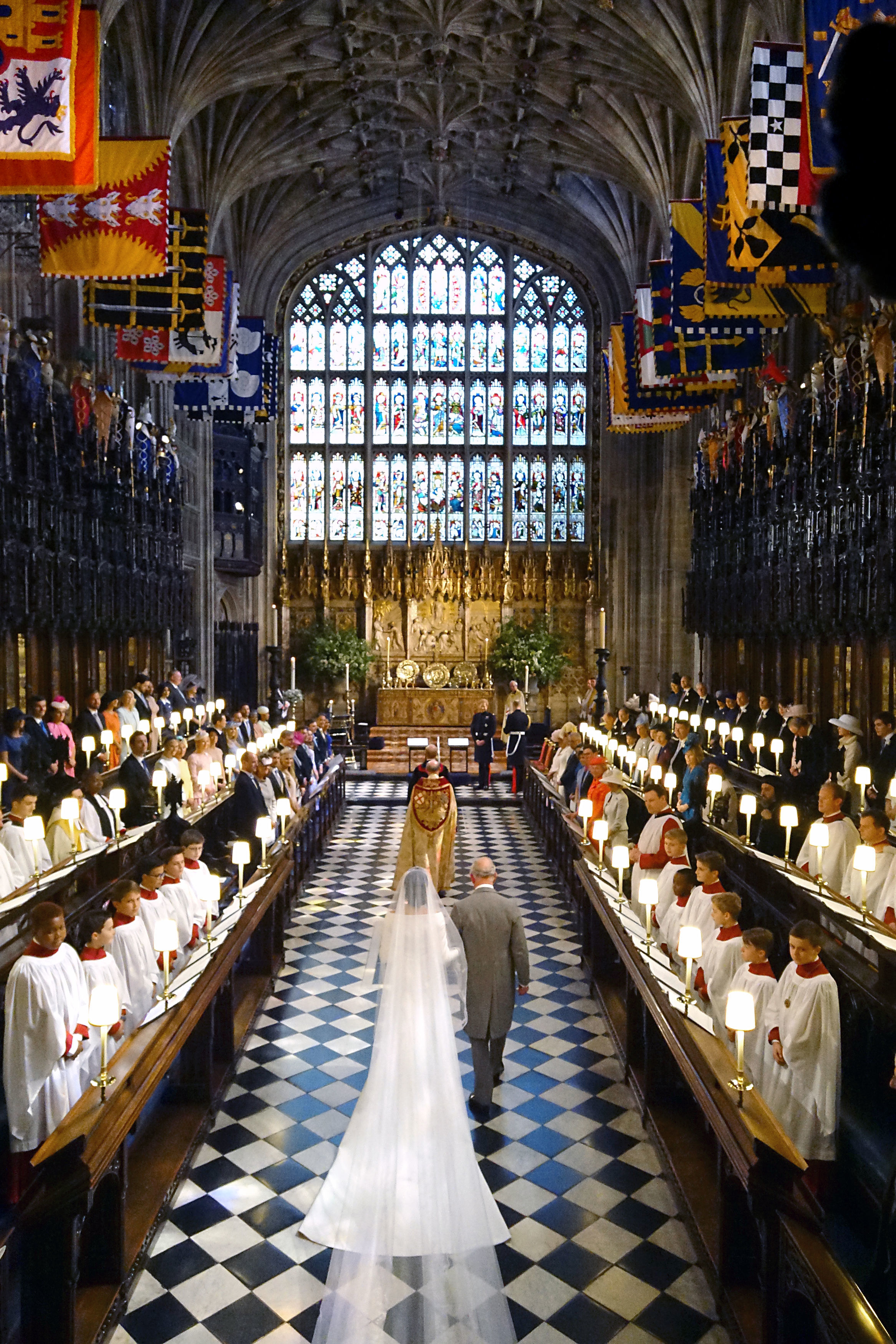 The Prince of Wales walking Meghan Markle up the aisle of St George's Chapel in 2018 