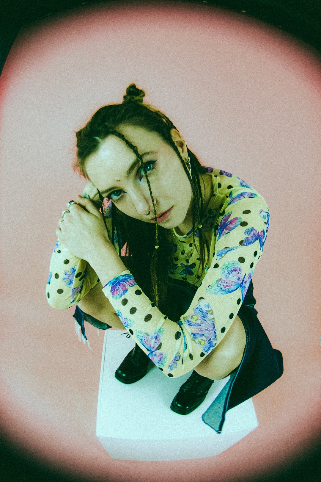 Woman kneeling down and looking up at the camera