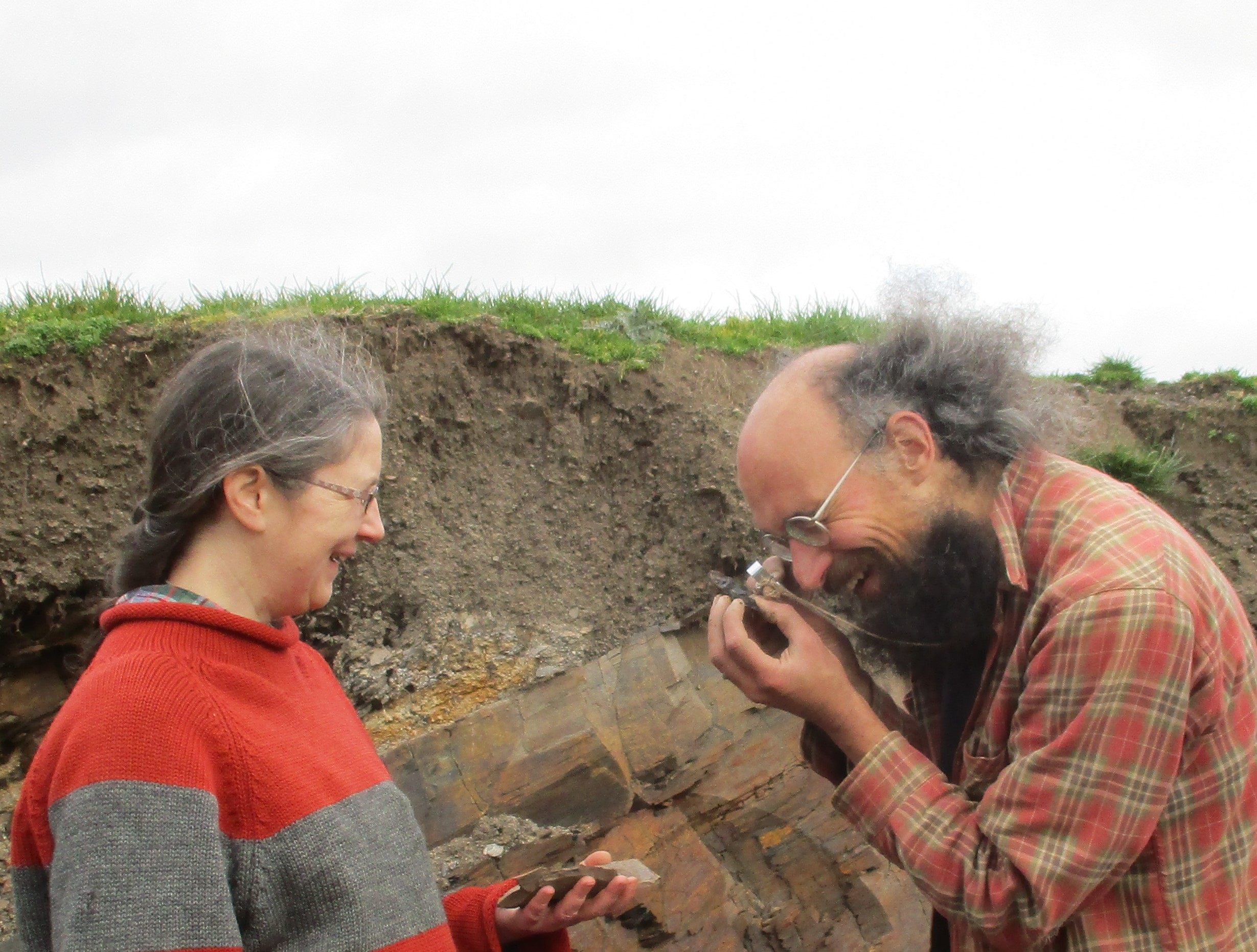 Dr Lucy Muir and Dr Joe Botting examine a specimen at the Castle Bank site (Joe Botting/PA)