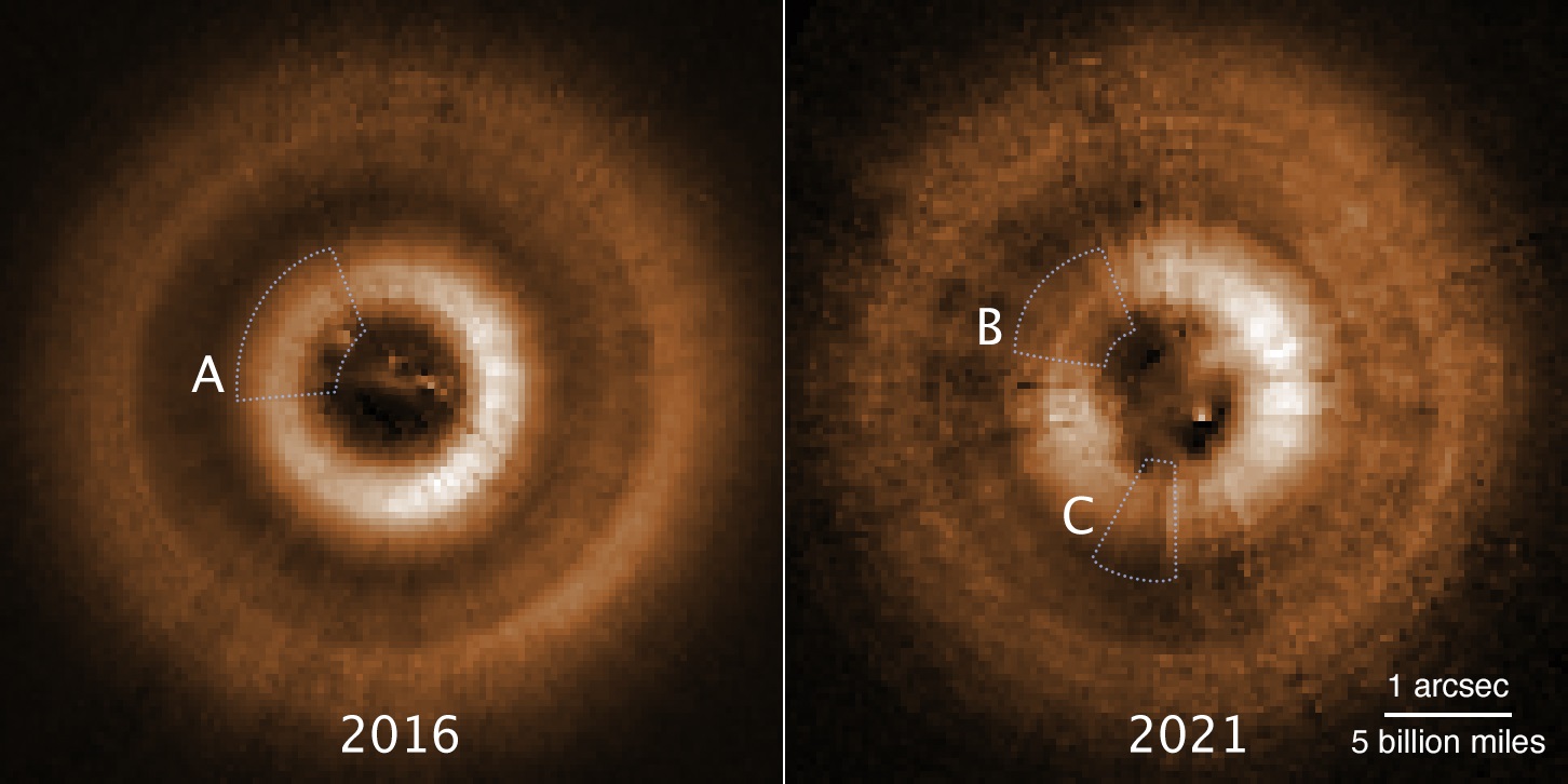 Comparison images from the Hubble Space Telescope, taken several years apart, have uncovered two eerie shadows moving counterclockwise across a gas-and-dust disk encircling the young star TW Hydrae