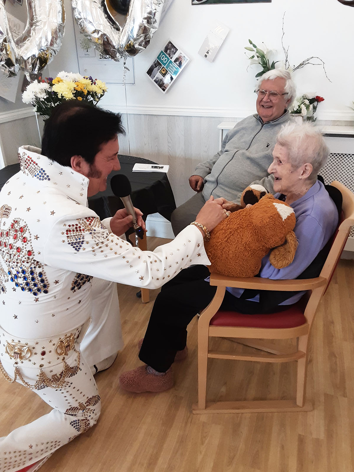 Ms XX enjoying a performance from an Elvis Presley tribute act who serenaded her with her favourite songs