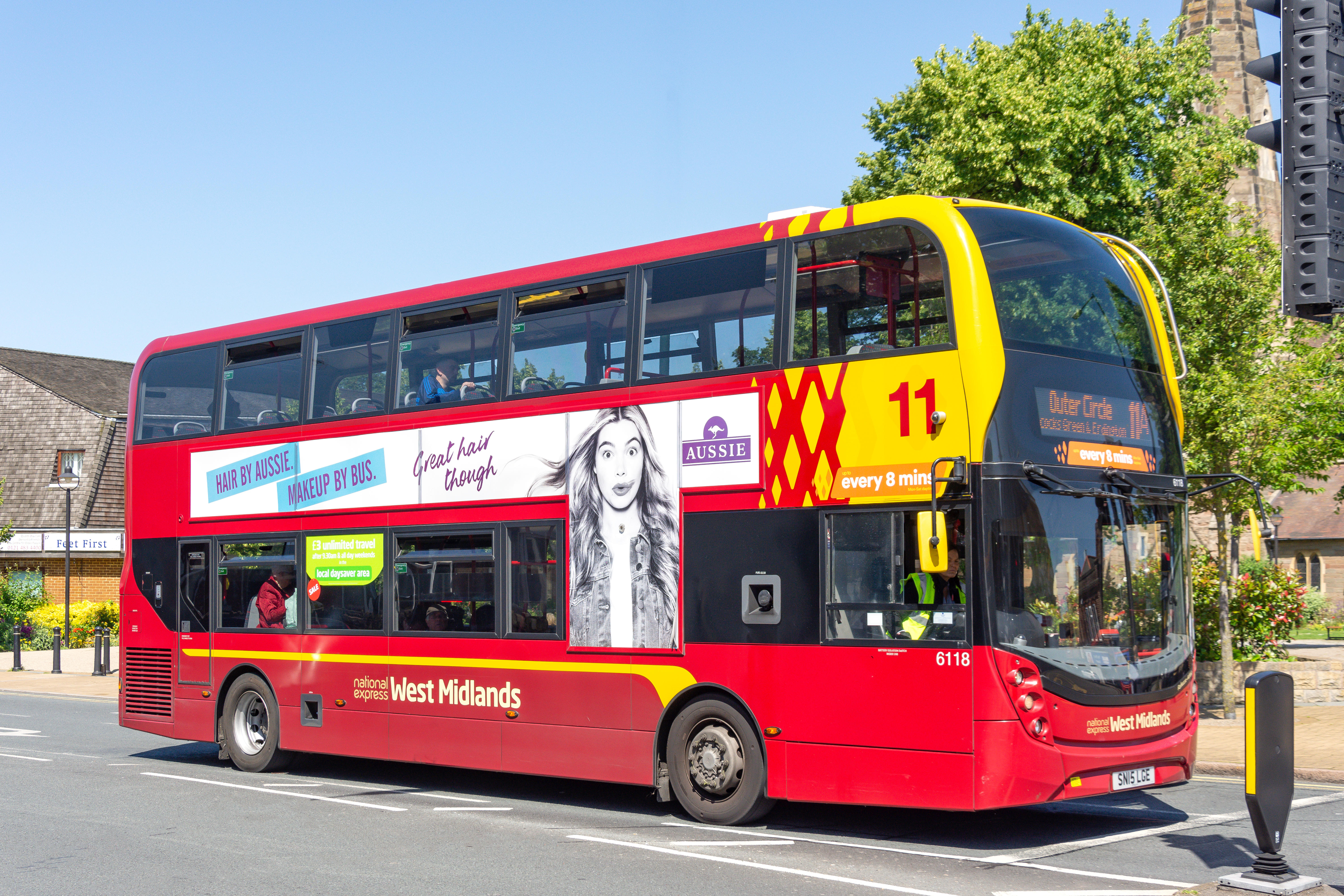 A red National Express West Midlands double-decker bus