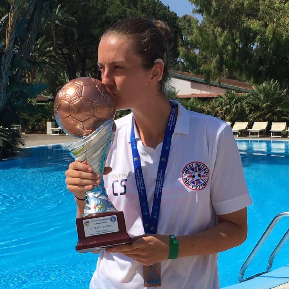 Woman kissing a trophy