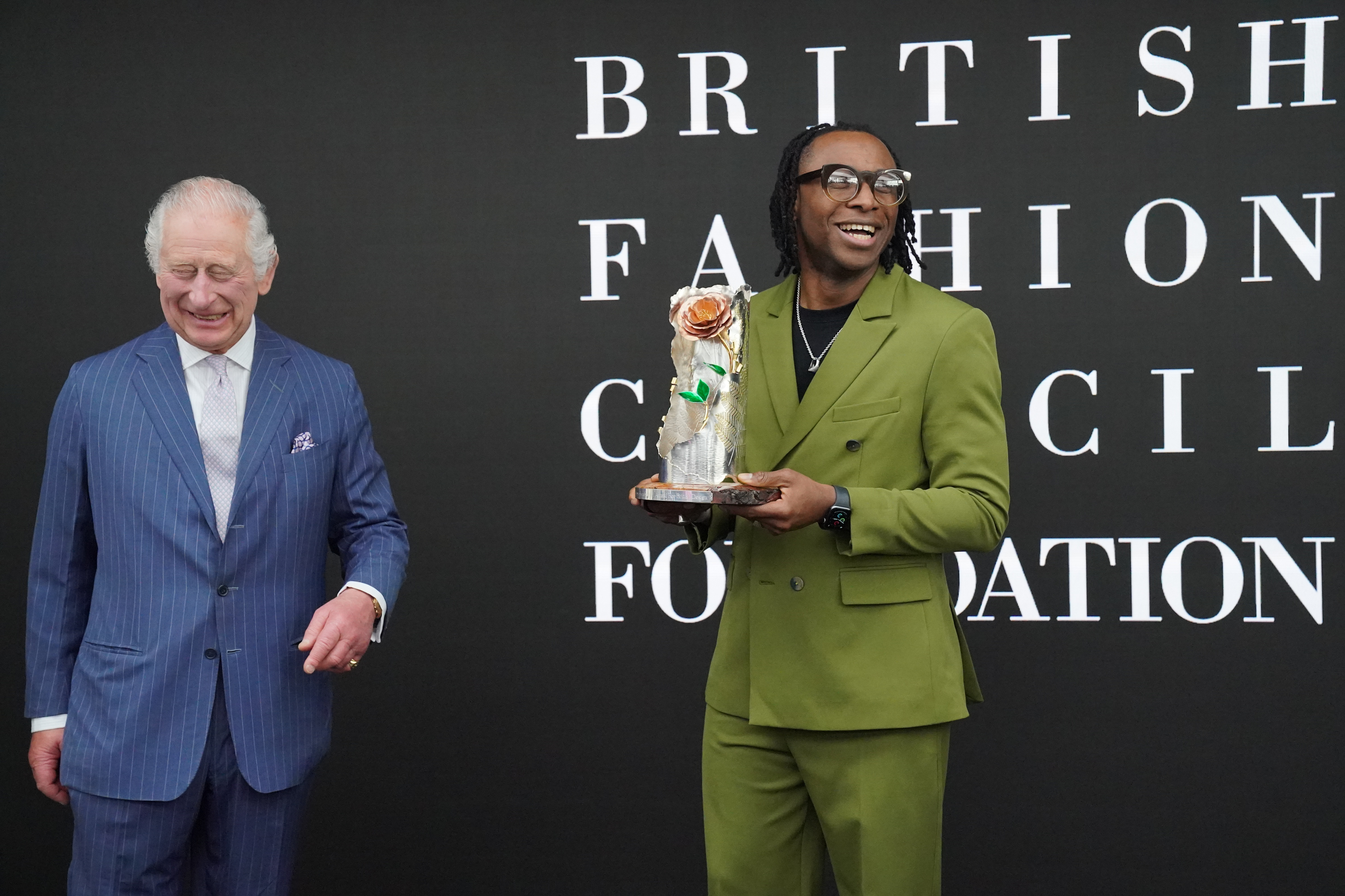 Charles presenting Dumbuya with the award