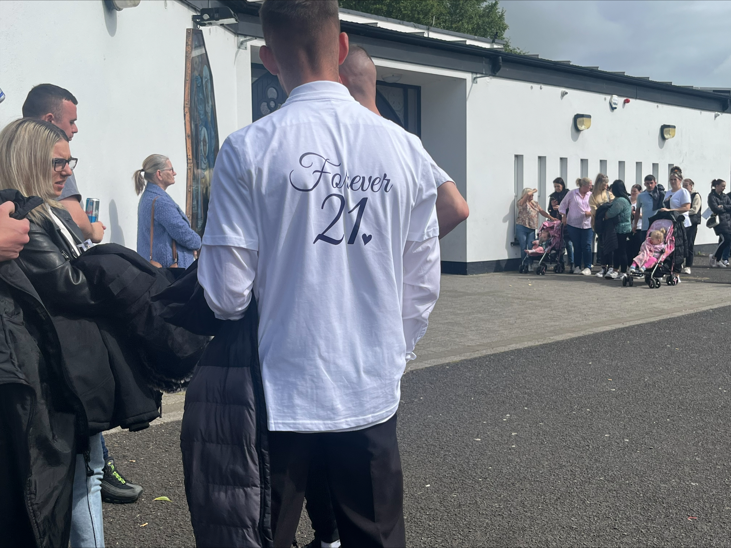 Mourner at the funeral of Rebecca Browne, wearing a t shirt with 'Forever 21' written on the back. Ms Browne died aged 21 -years-old after being hit by a Garda car. (Claudia Savage/PA)