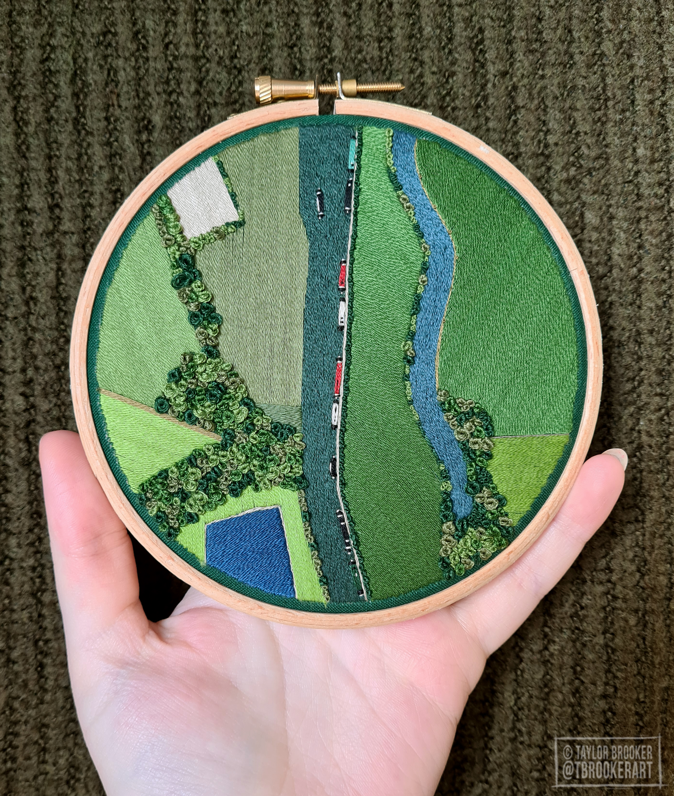 Embroidered landscape scene