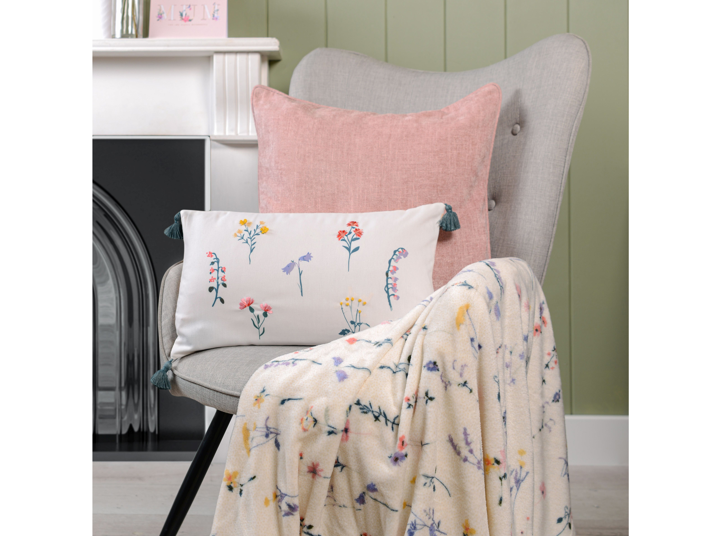 Meadow Flowers Fleece Throw – Yellow by My Home, £5.99, Meadow Flowers Embellished Cushion – White by Divante, £8.99, The Range