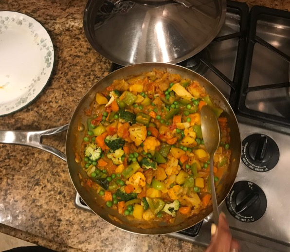 Raisa Ali cooking in her kitchen