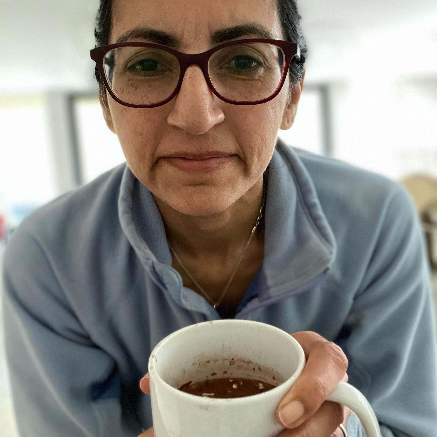 Raisa Ali holding a mug
