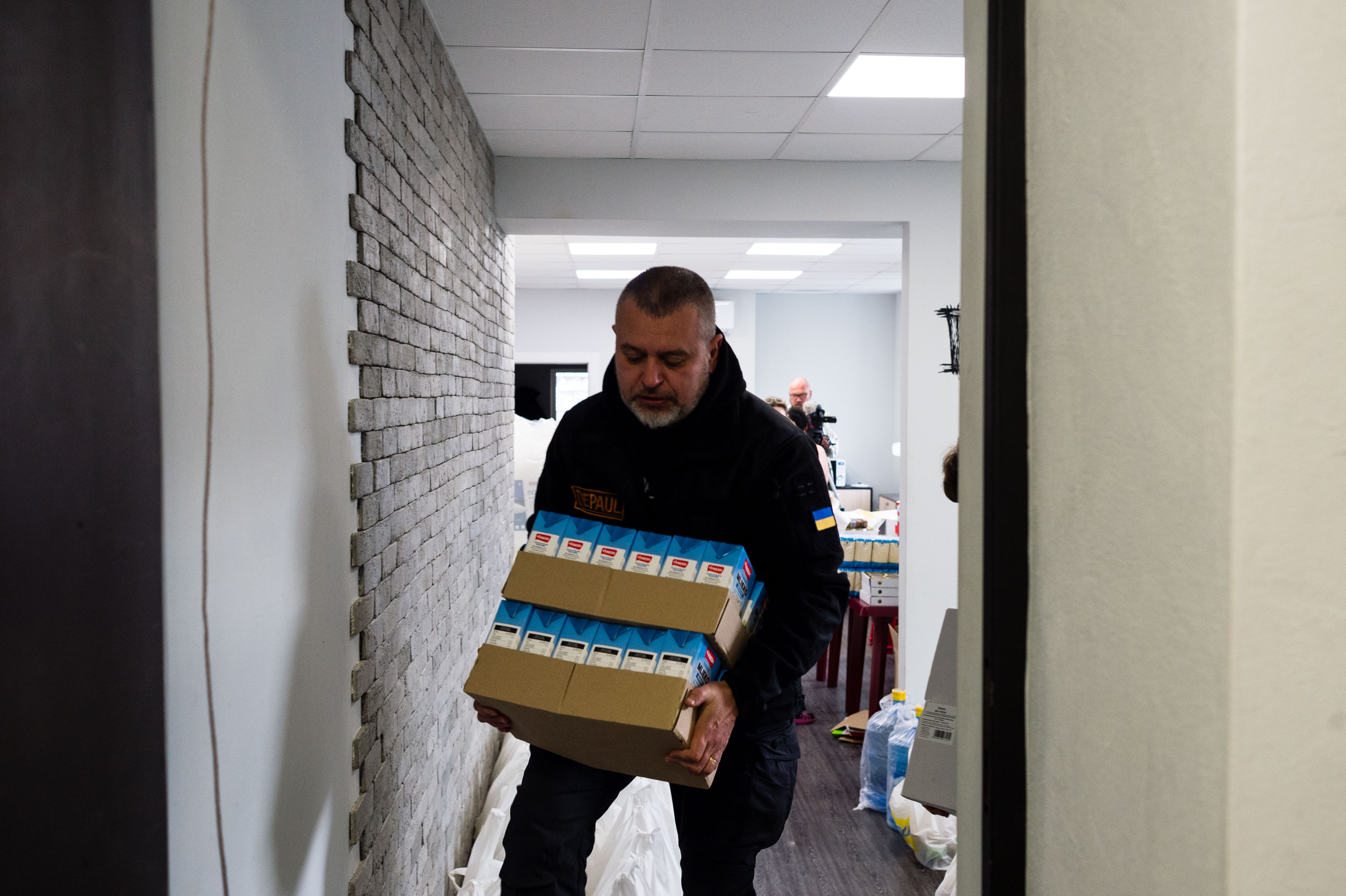 At a Day Centre run by Depaul International, Father Vitaliy Novak loads up food ready for distribution to people in need in Kharkiv, on 15th November 2022