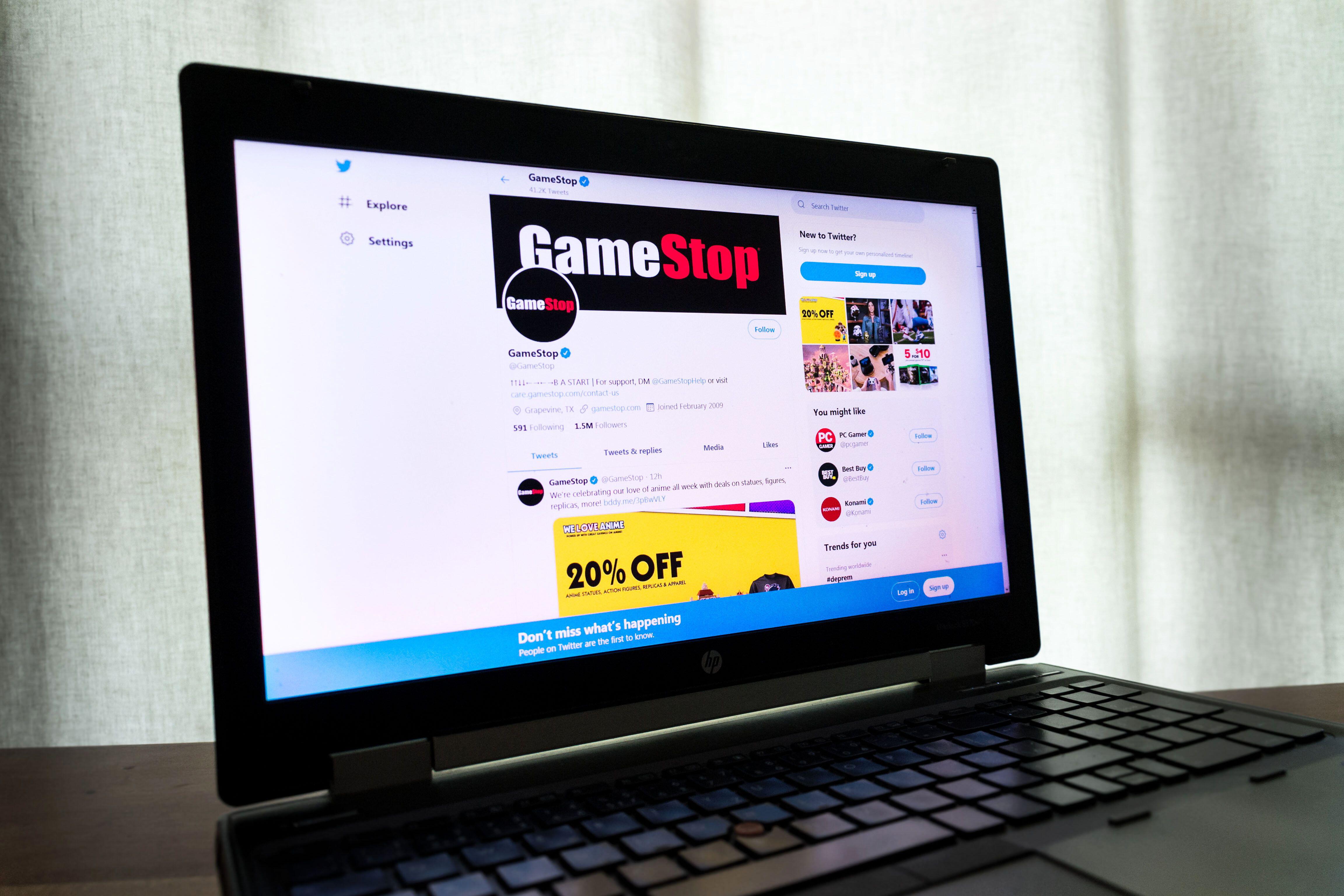 A laptop showing the GameStop Twitter account