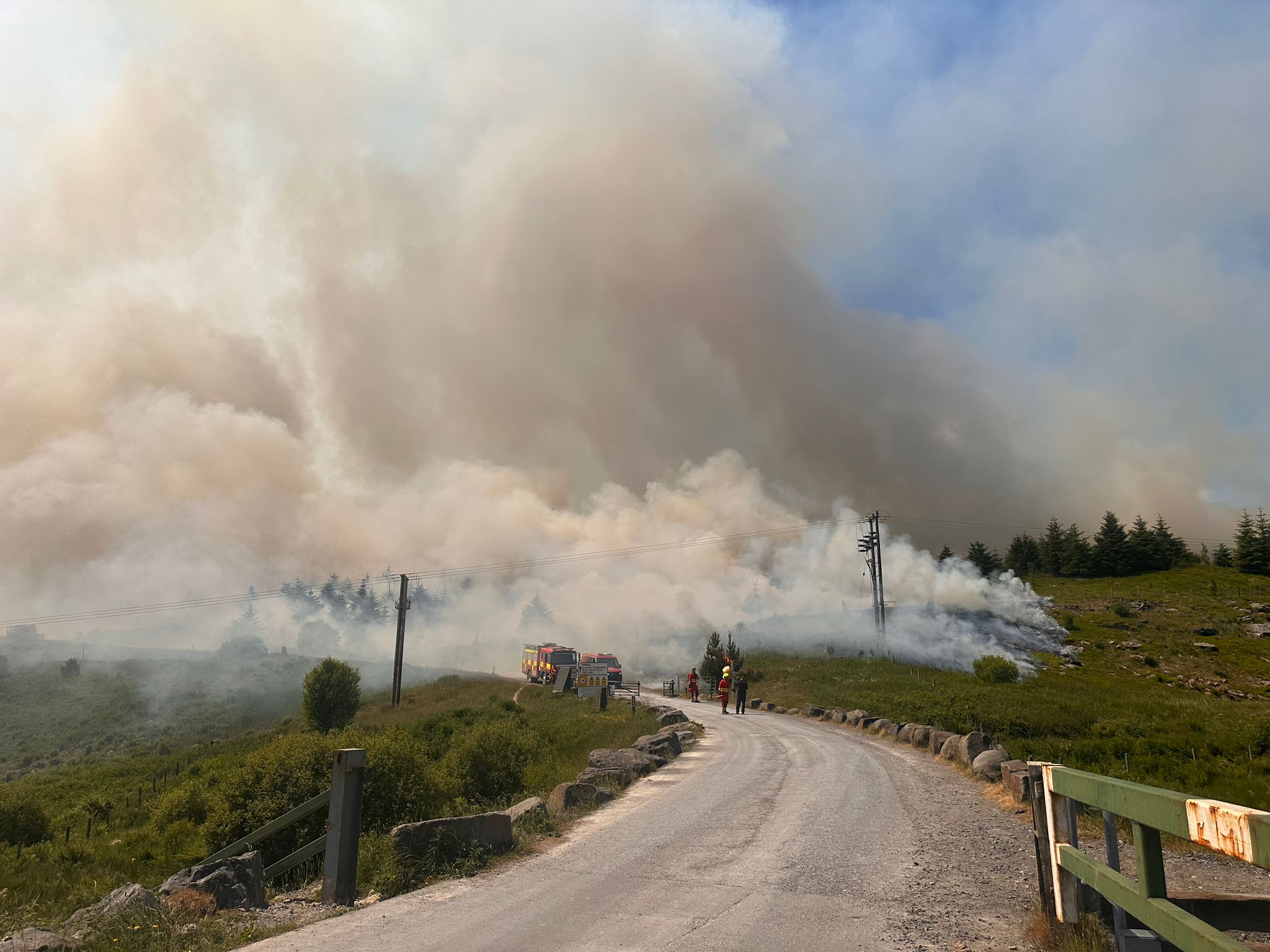 Smoke billowing across road in the Rhigos Mountain where a large fire has been burning for almost a week. (South Wales Fire and Rescue)