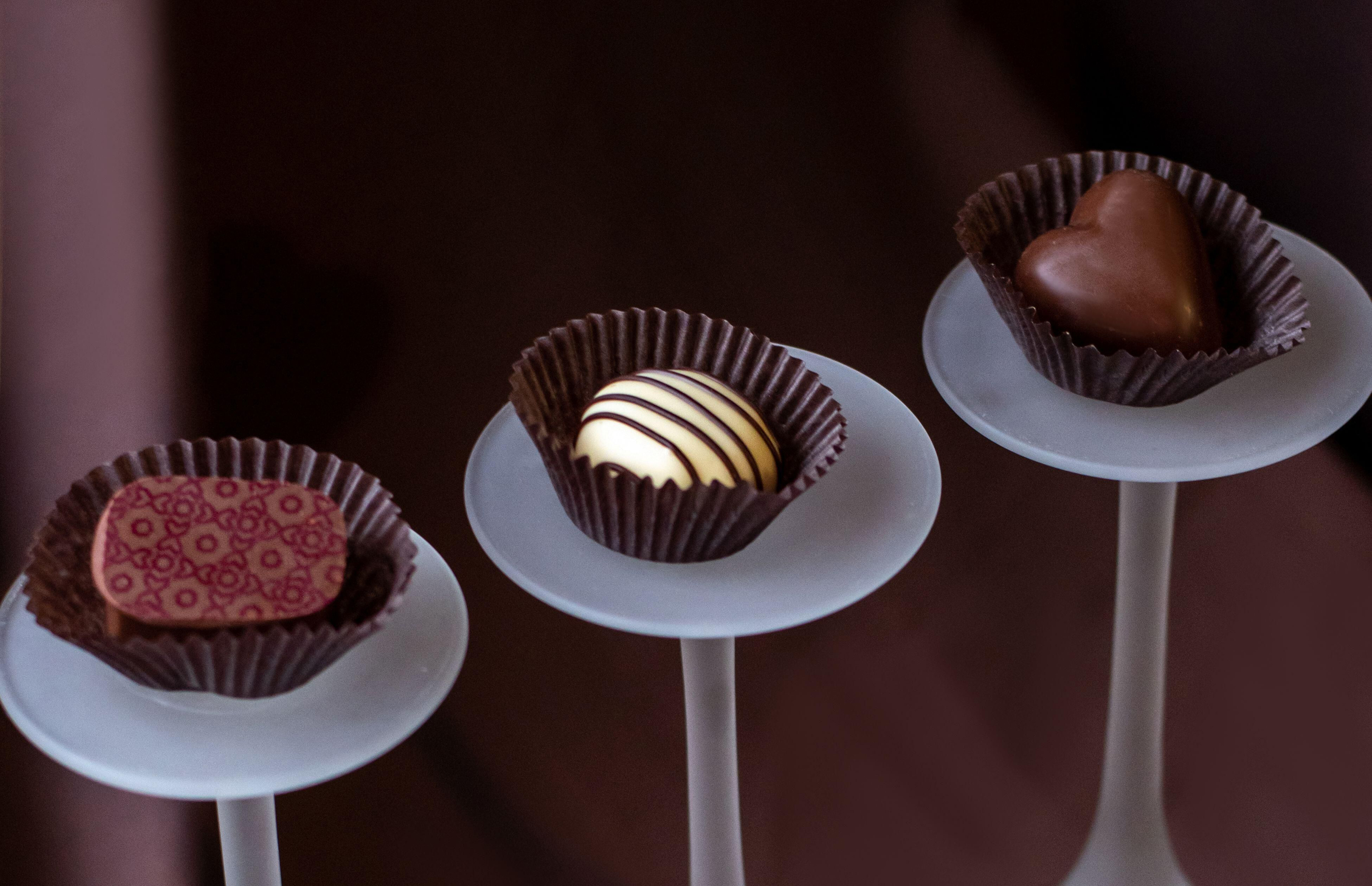 A variety of fancy chocolates on glass pedestals