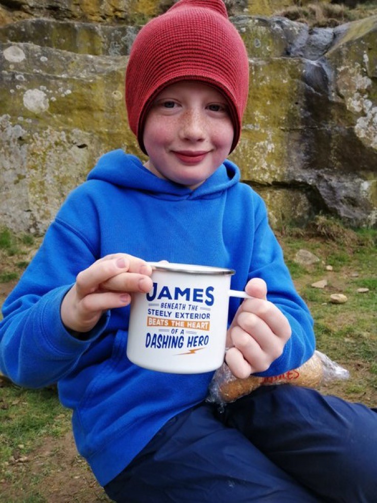 Boy holding a mug