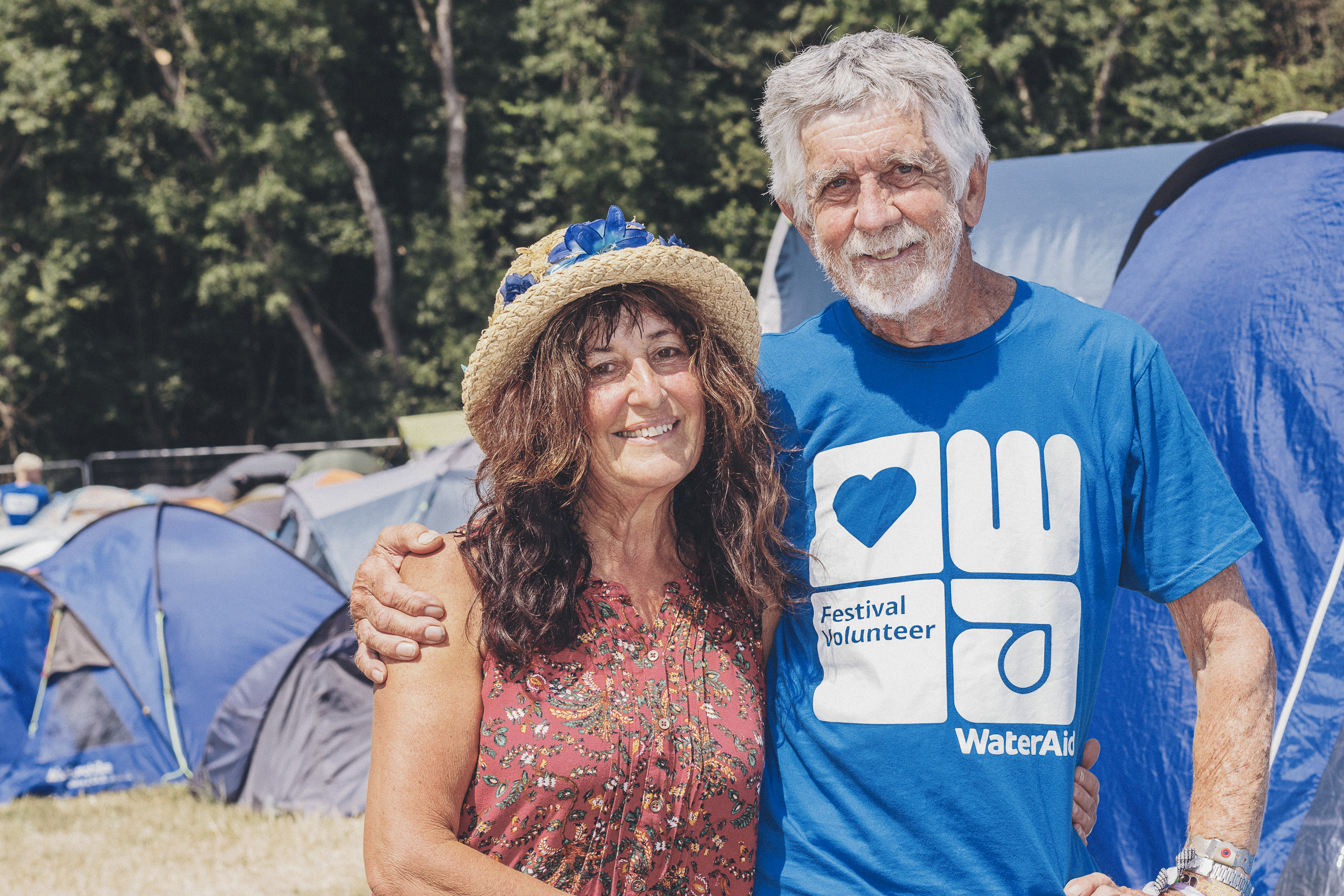 Man and woman standing together and smiling 