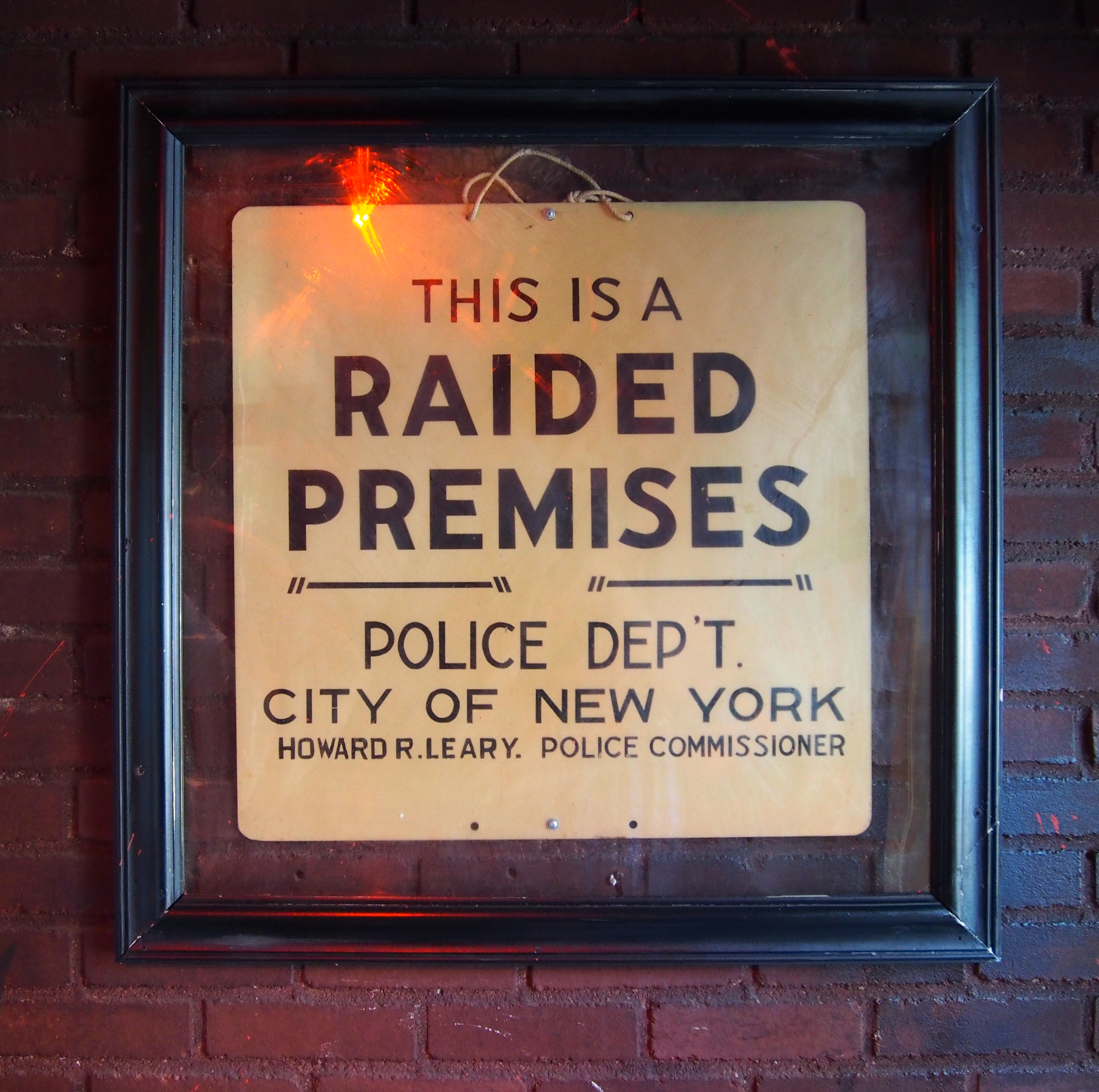 The original 'Raided Premises' sign inside The Stonewall Inn 