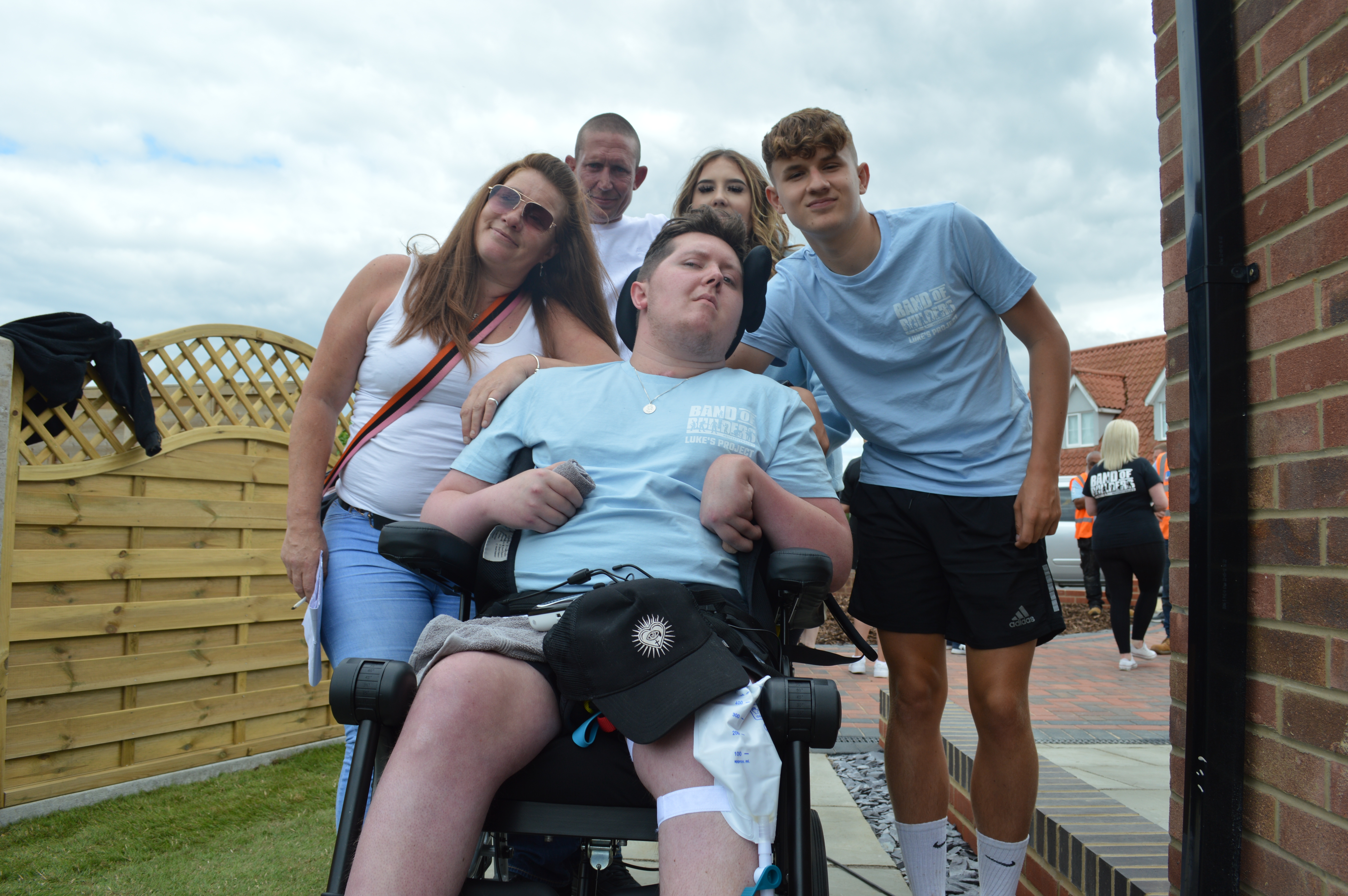 Luke Goold-Hannatt with his family. (Band of Builders/ PA)