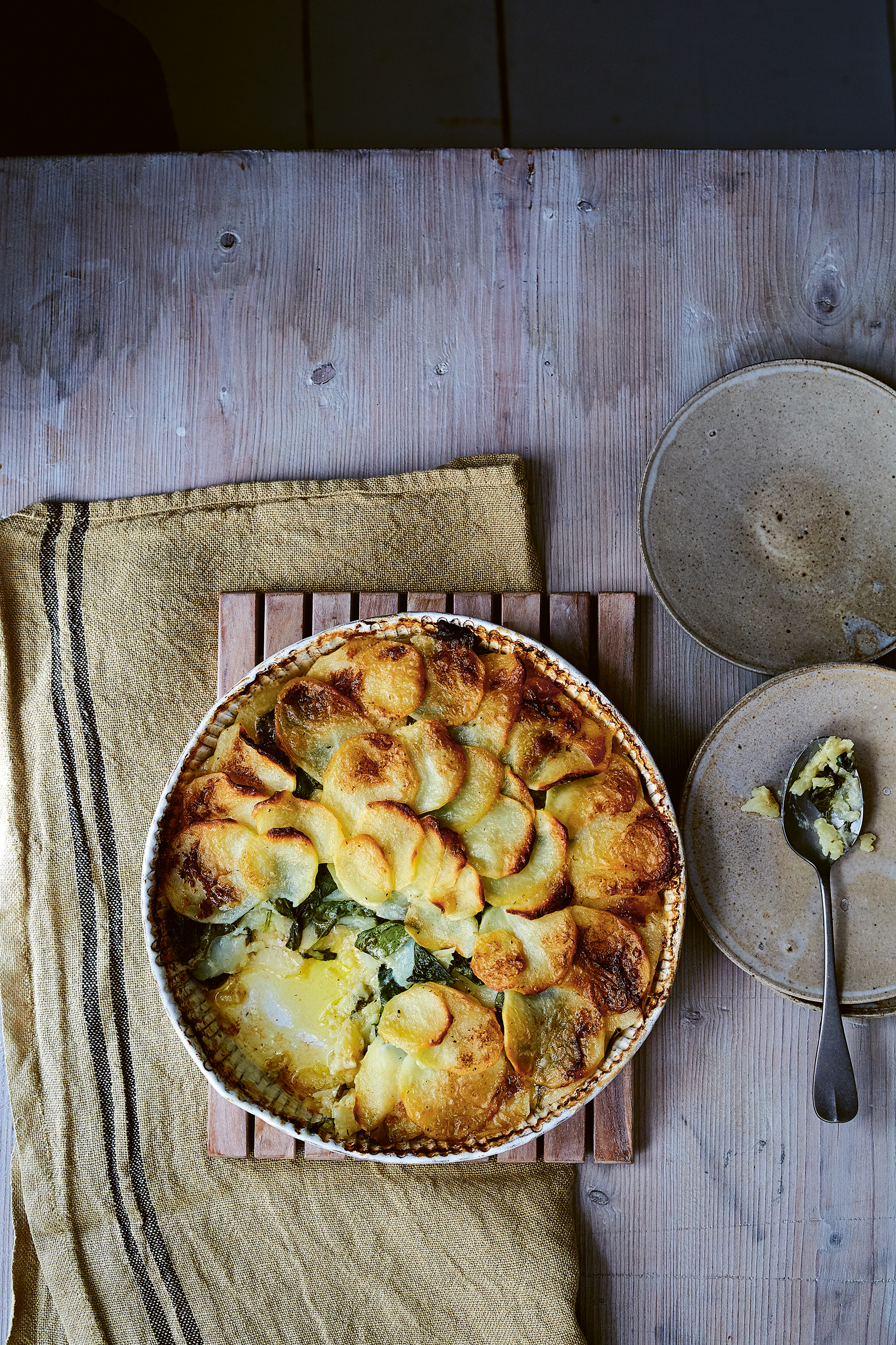 Dauphinoise potatoes with spinach and clotted cream