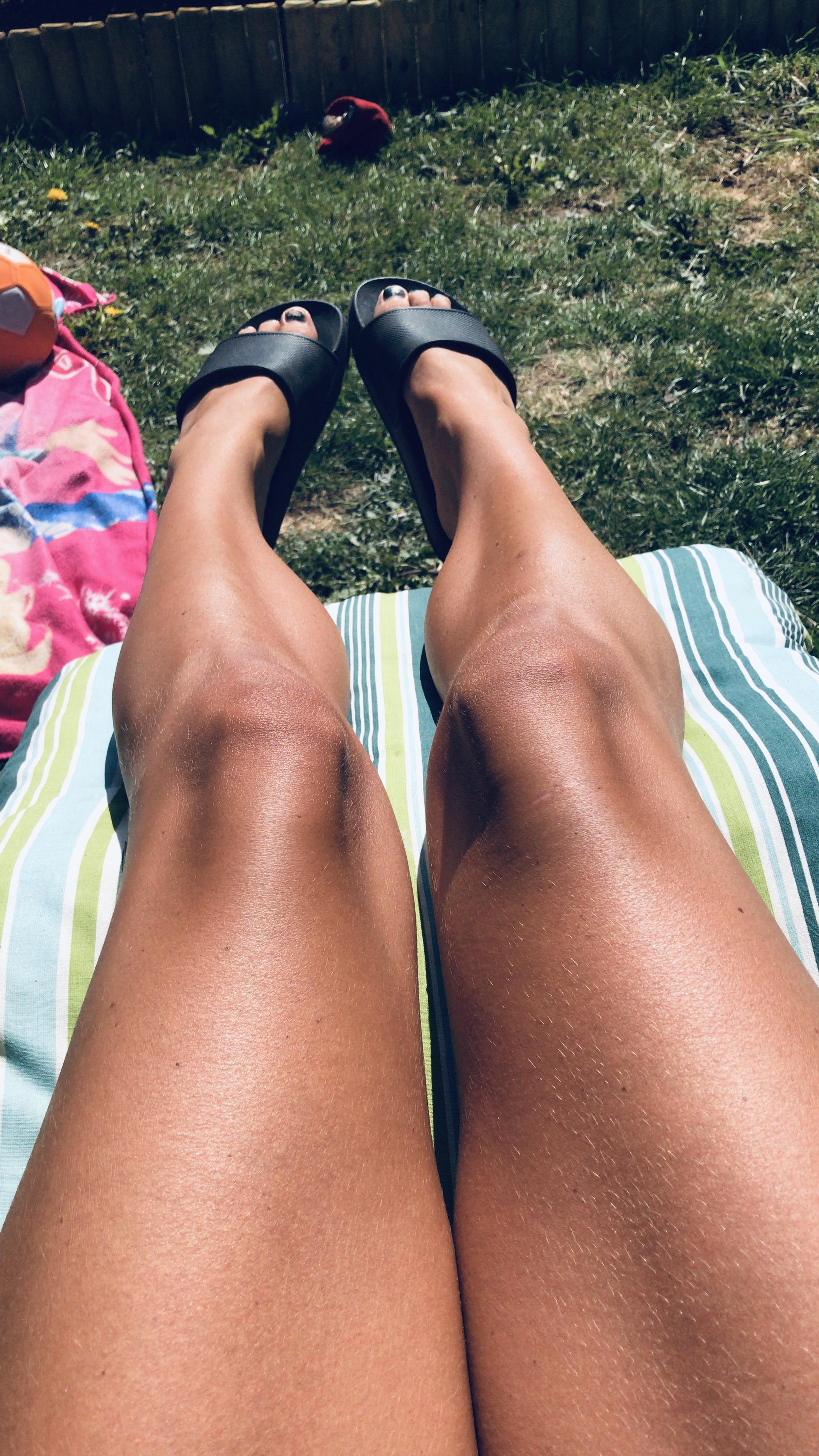 woman tanning legs